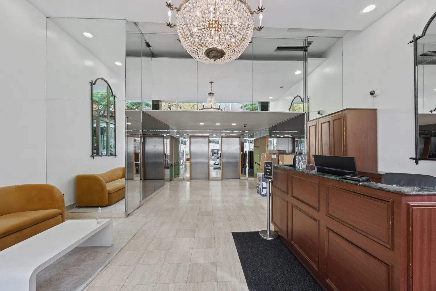 a view of a living room and chandelier