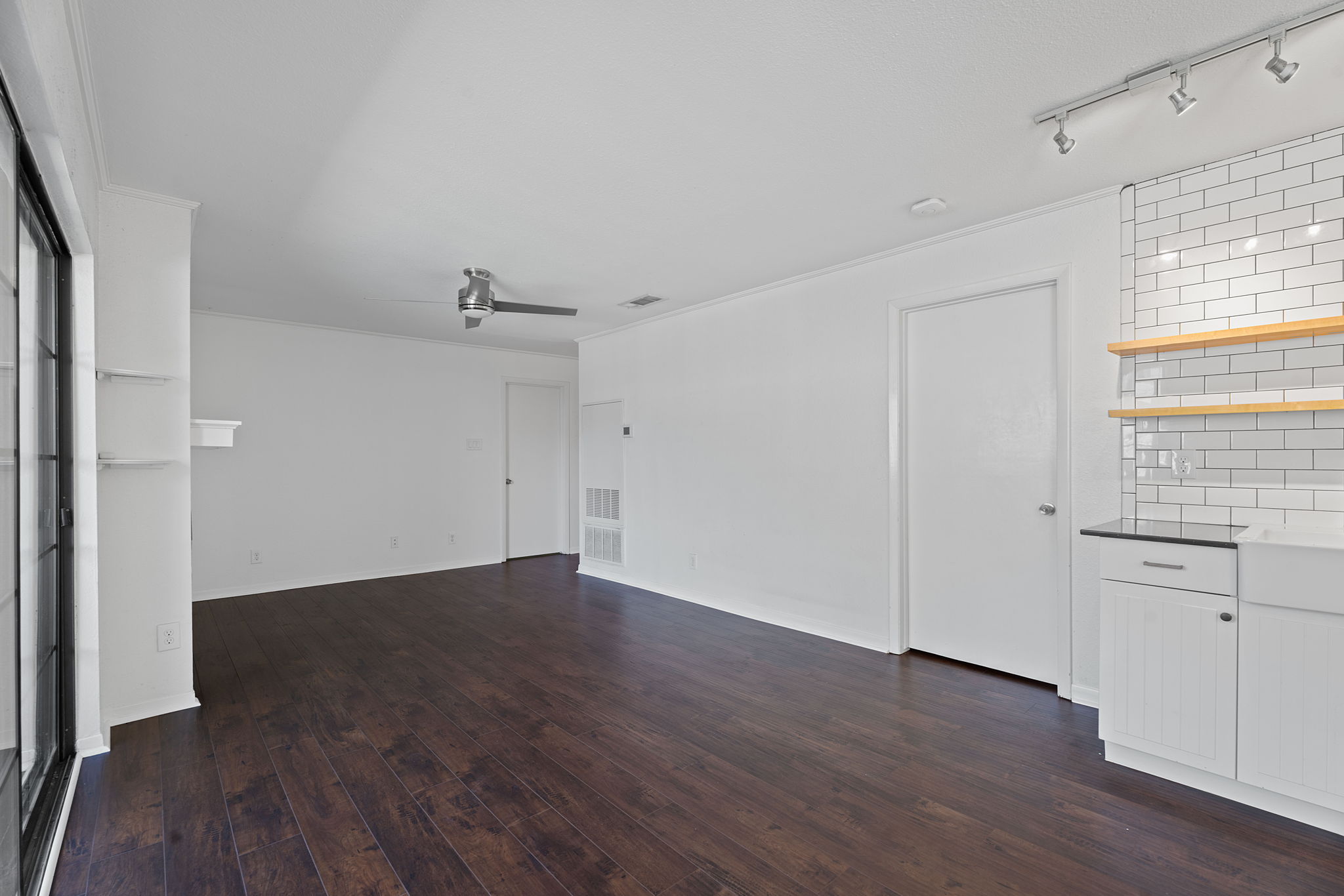 1510 West N Loop Boulevard, Unit 424 Austin, TX 78756 - Photo 12 of 25 an empty room with wooden floor and windows
