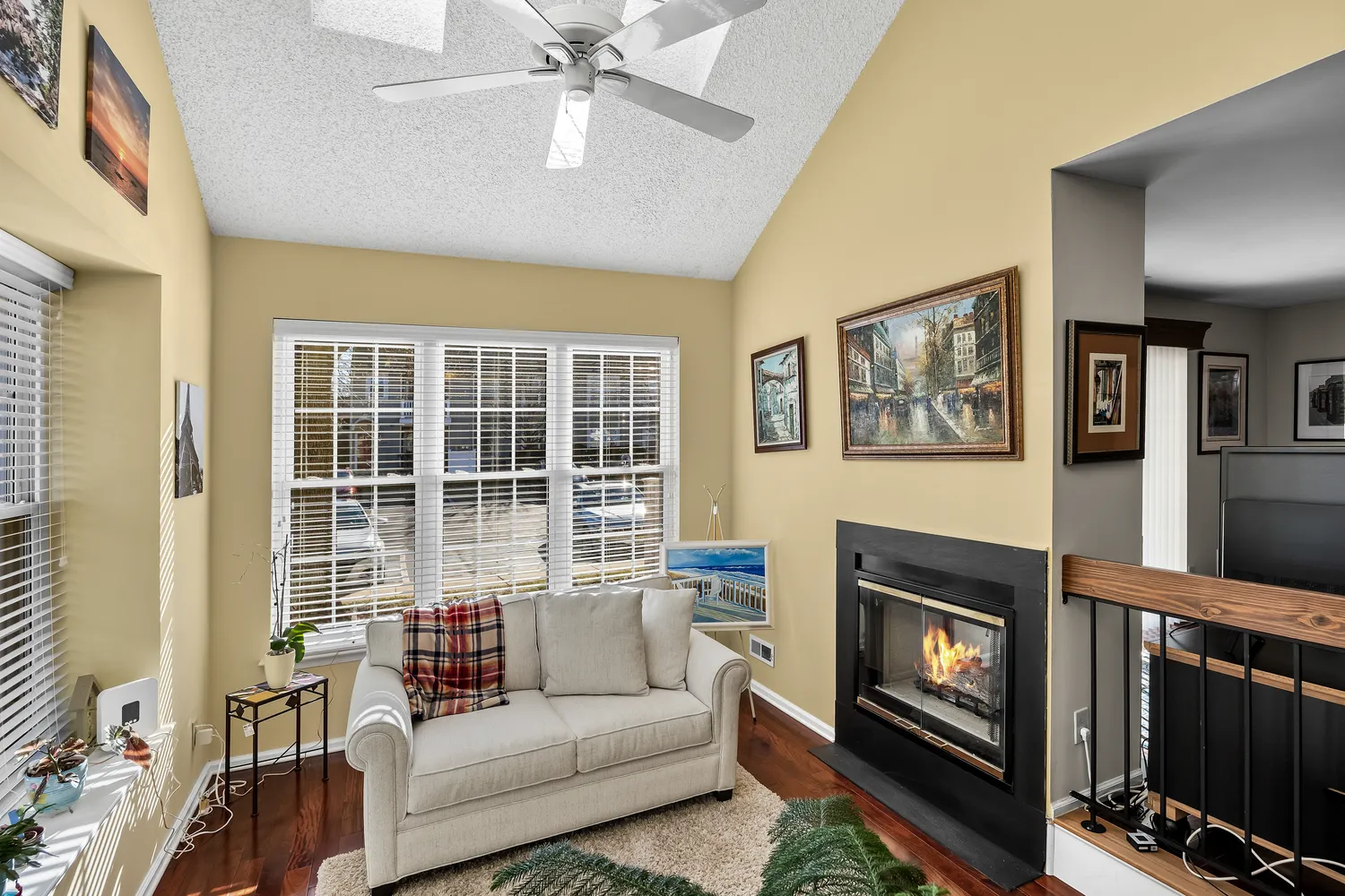 a living room with furniture and a fireplace