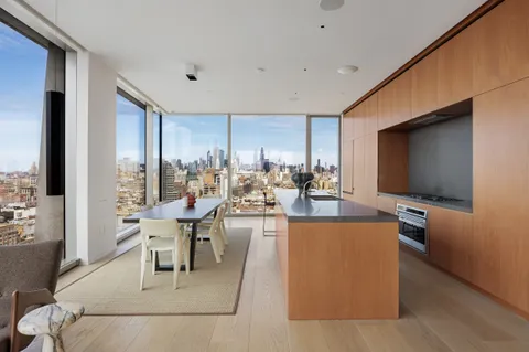 a living room with fireplace furniture and a flat screen tv