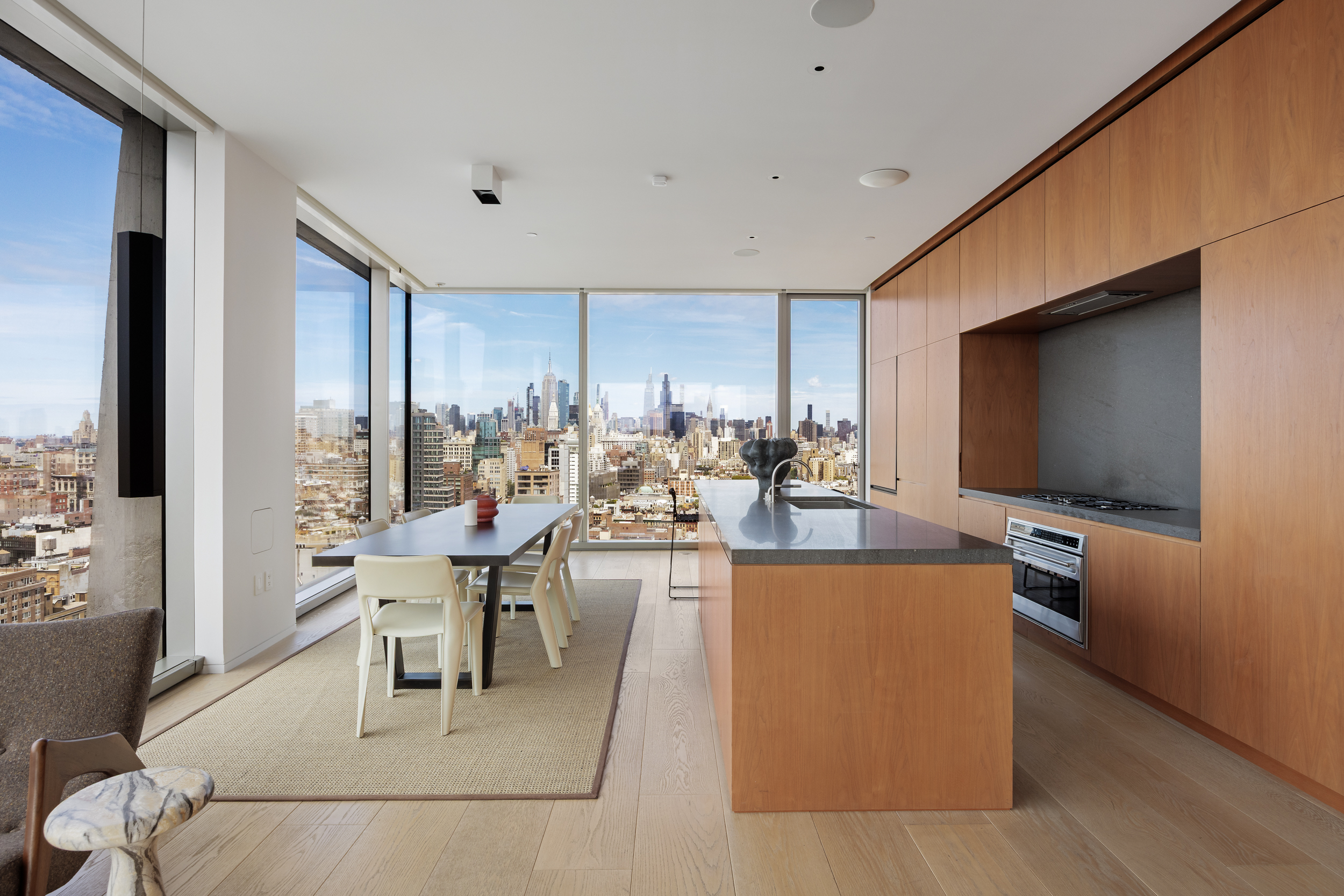215 Chrystie Street, Unit 29W Manhattan, NY 10002 - Photo 8 of 24 a living room with fireplace furniture and a flat screen tv
