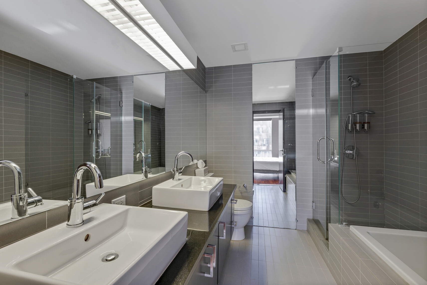 150 Myrtle Avenue, Unit 803 Brooklyn, NY 11201 - Photo 10 of 29 a bathroom with a double vanity sink mirror and shower