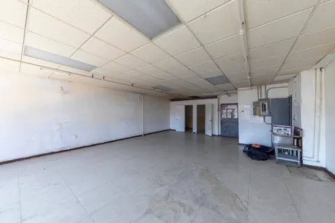 a view of a livingroom with an empty space and window