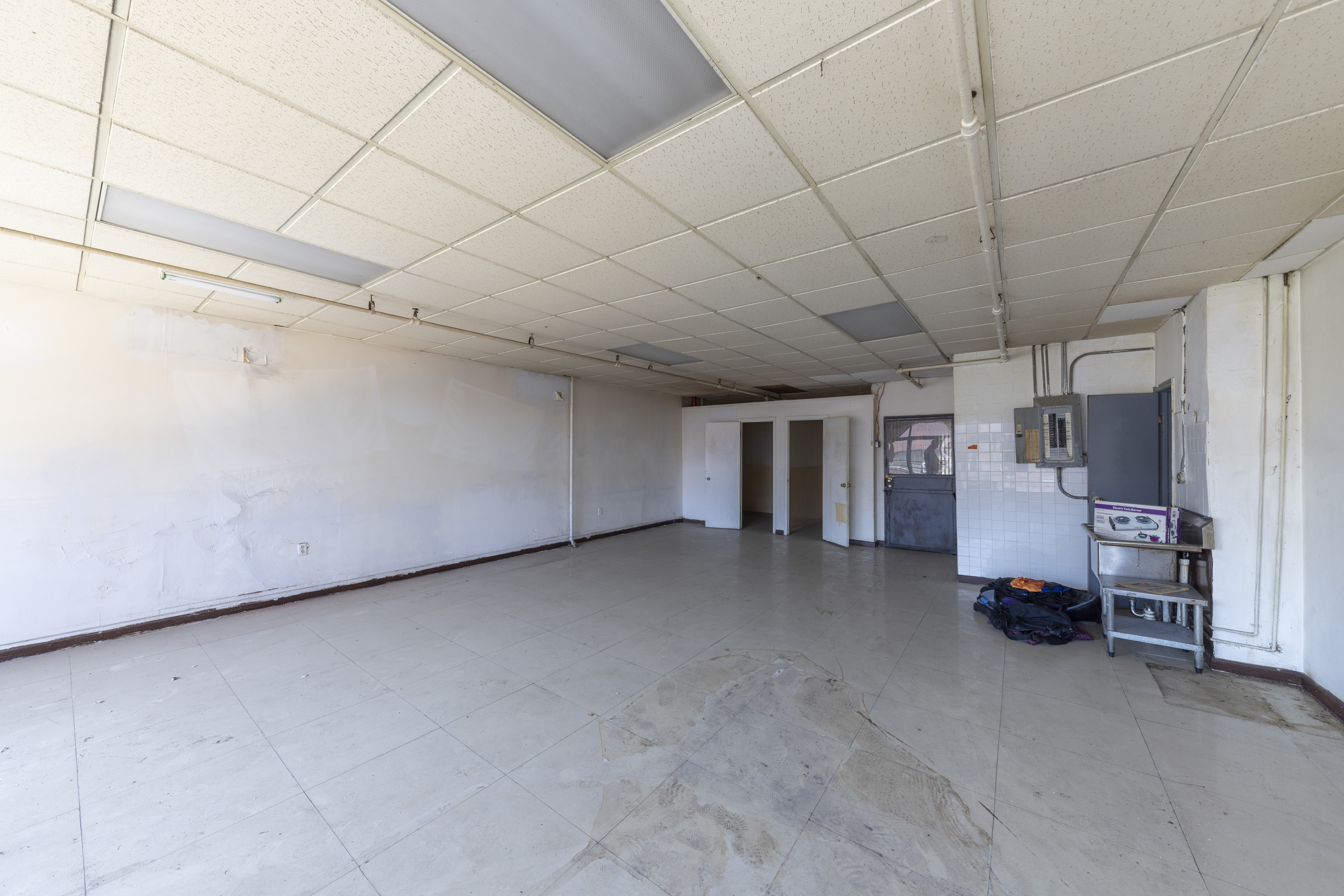 47 Division Street Manhattan, NY 10002 - Photo 5 of 11 a view of a livingroom with gym equipment and a window