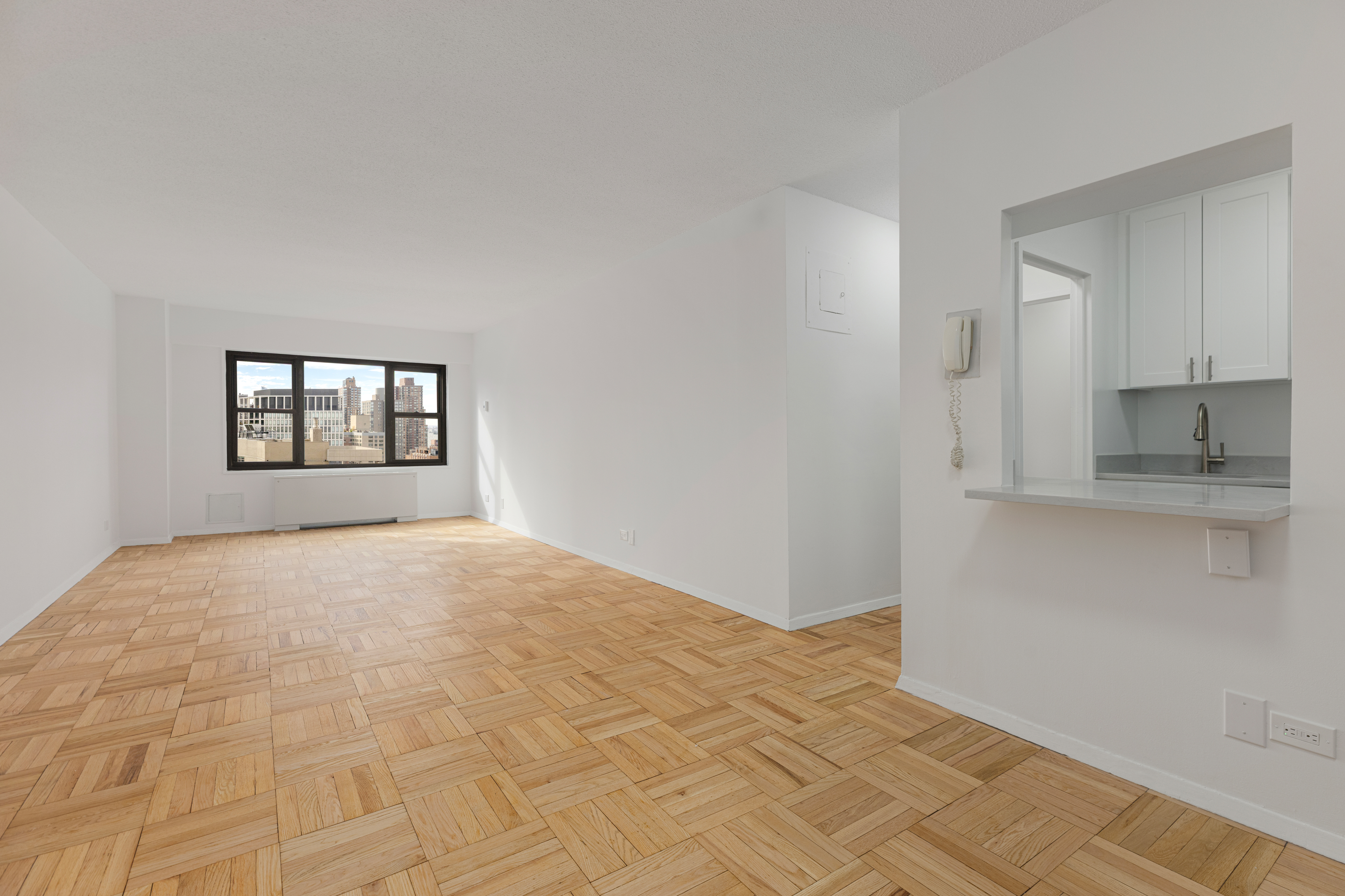 20 West 64th Street, Unit 35T Manhattan, NY 10023 - Photo 2 of 7 a bedroom with a bed and a window