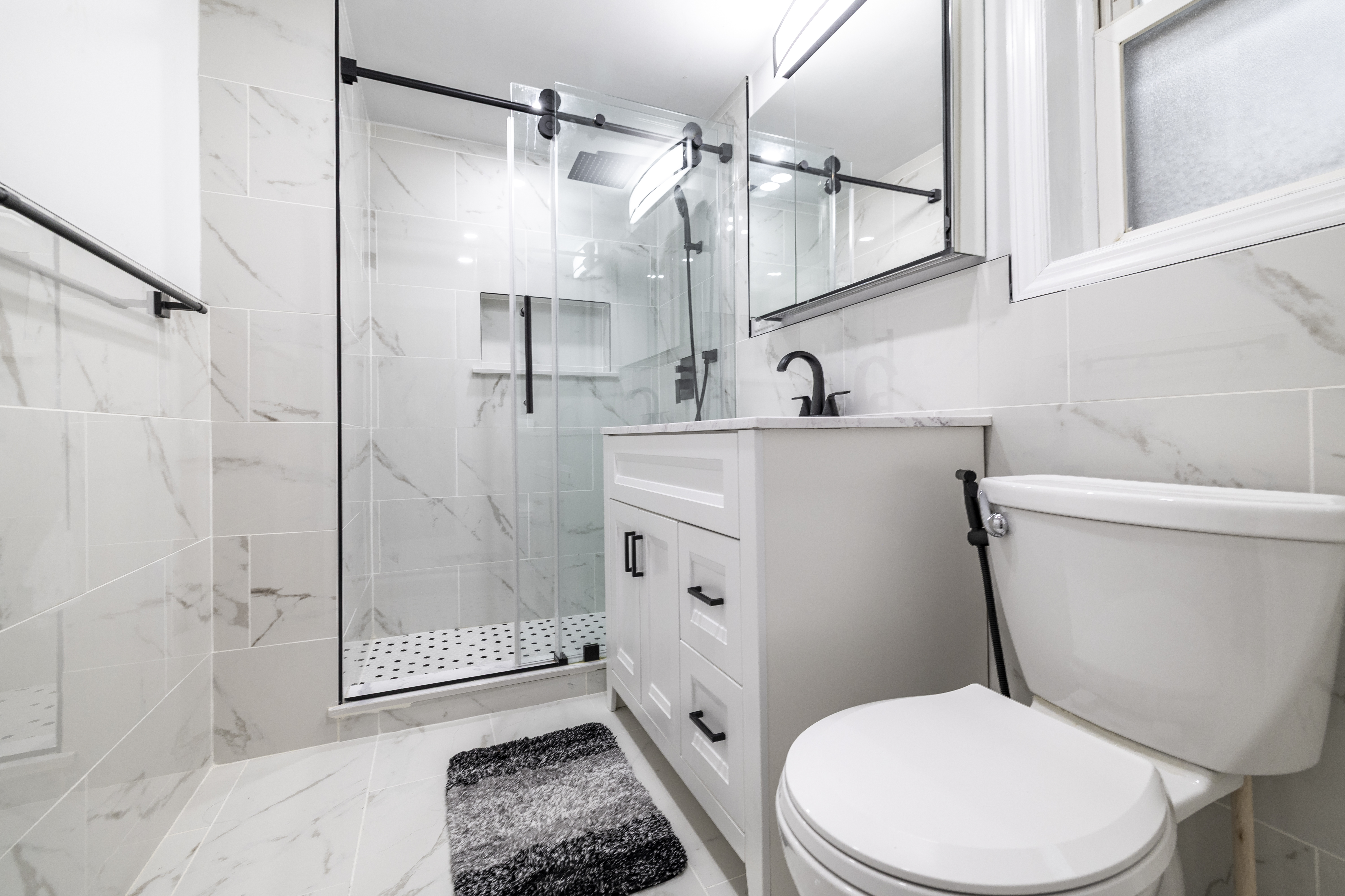 87-46 89th Street Queens, NY 11421 - Photo 11 of 25 a white toilet sitting next to a bathroom sink