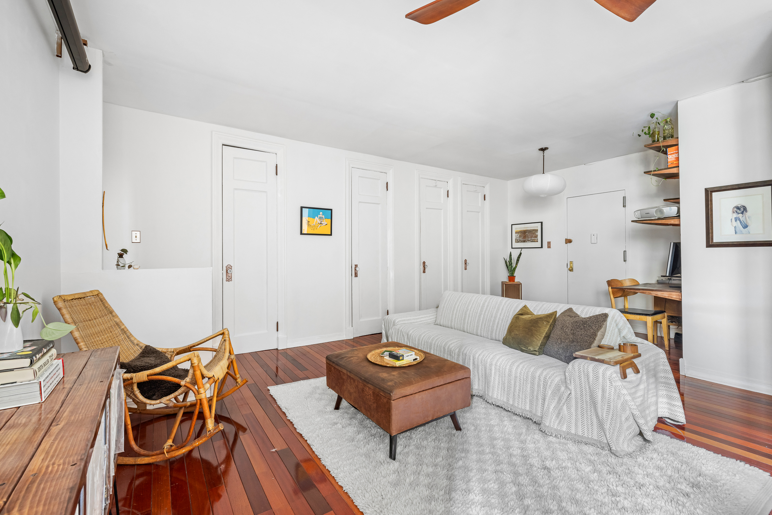 7901 4th Avenue Brooklyn, NY 11209 - Photo 7 of 10 a living room with furniture and wooden floor