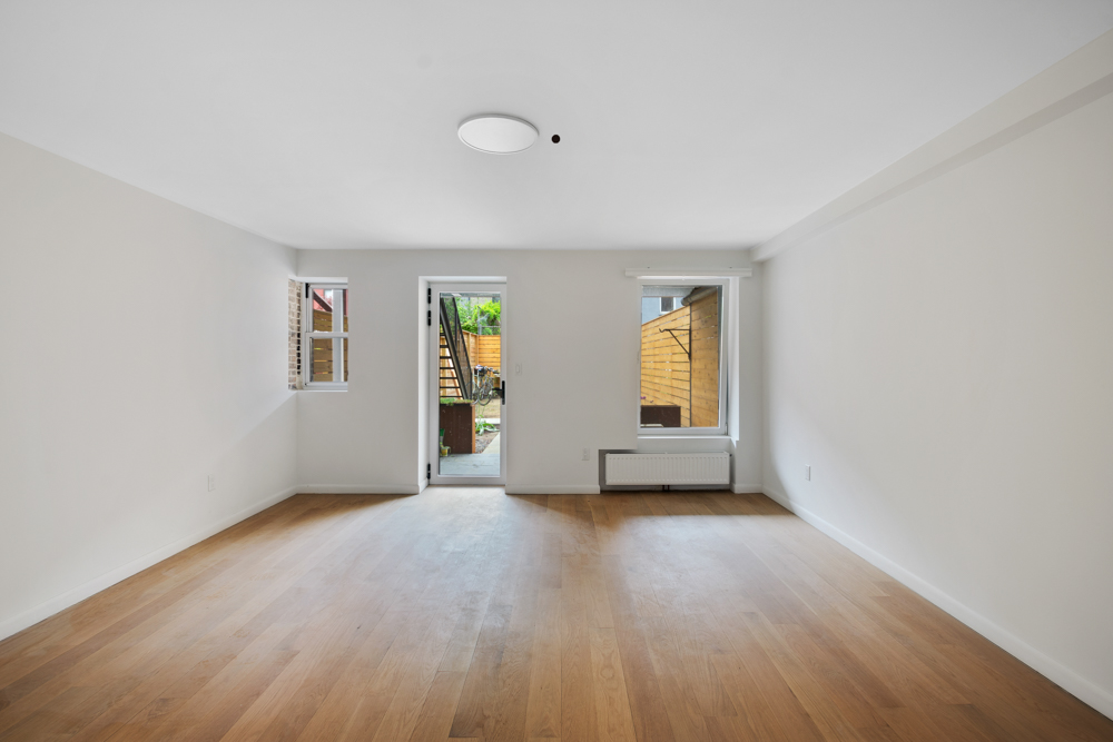 430 East 140th Street, Unit 2 Bronx, NY 10454 - Photo 2 of 10 an empty room with windows and closet