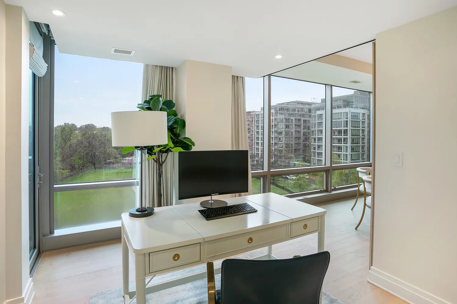a view of a workspace with furniture