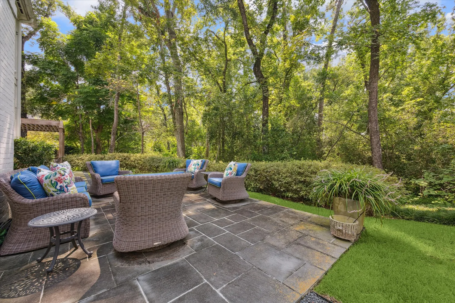 a view of a patio with a table and chairs