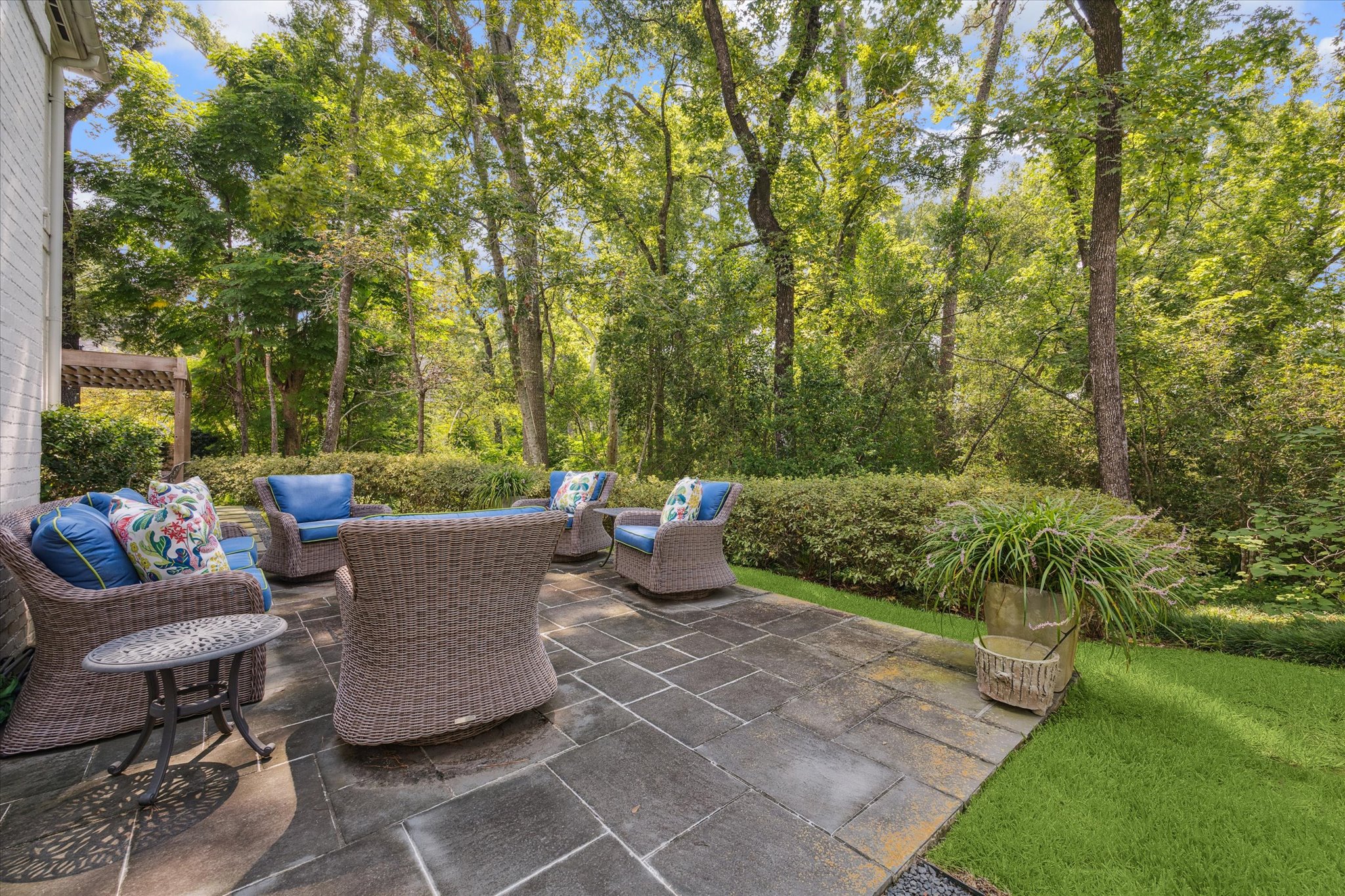 310 Longwoods Lane Houston, TX 77024 - Photo 43 of 49 a view of a patio with couches plants and large trees