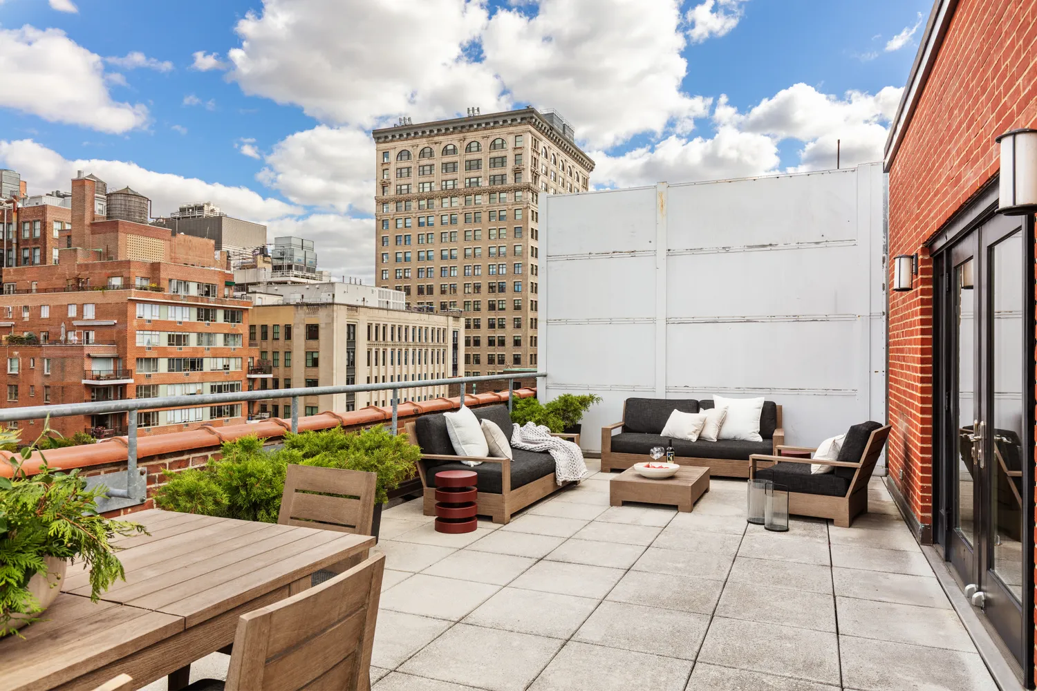 a building with potted plants in front of it