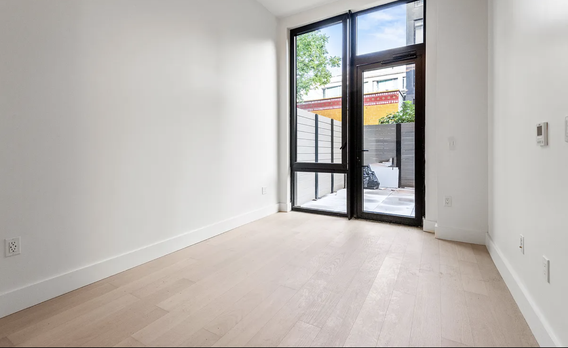218 Front Street, Unit 184 Brooklyn, NY 11201 - Photo 10 of 13 a view of an empty room with a window