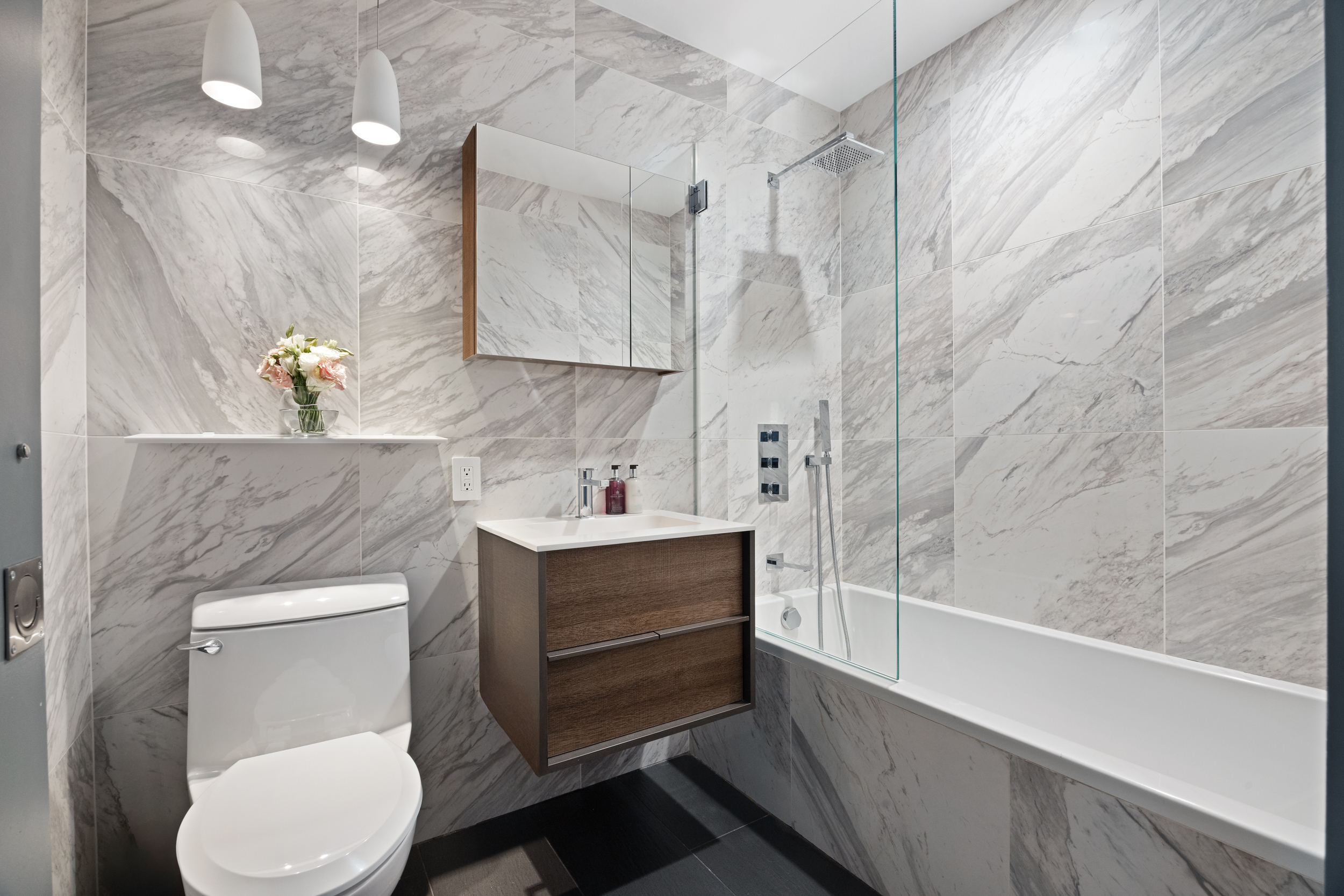 200 Chambers Street, Unit 7AI Manhattan, NY 10007 - Photo 16 of 28 a bathroom with a sink a toilet and shower