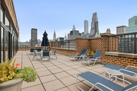 a view of roof with sitting area