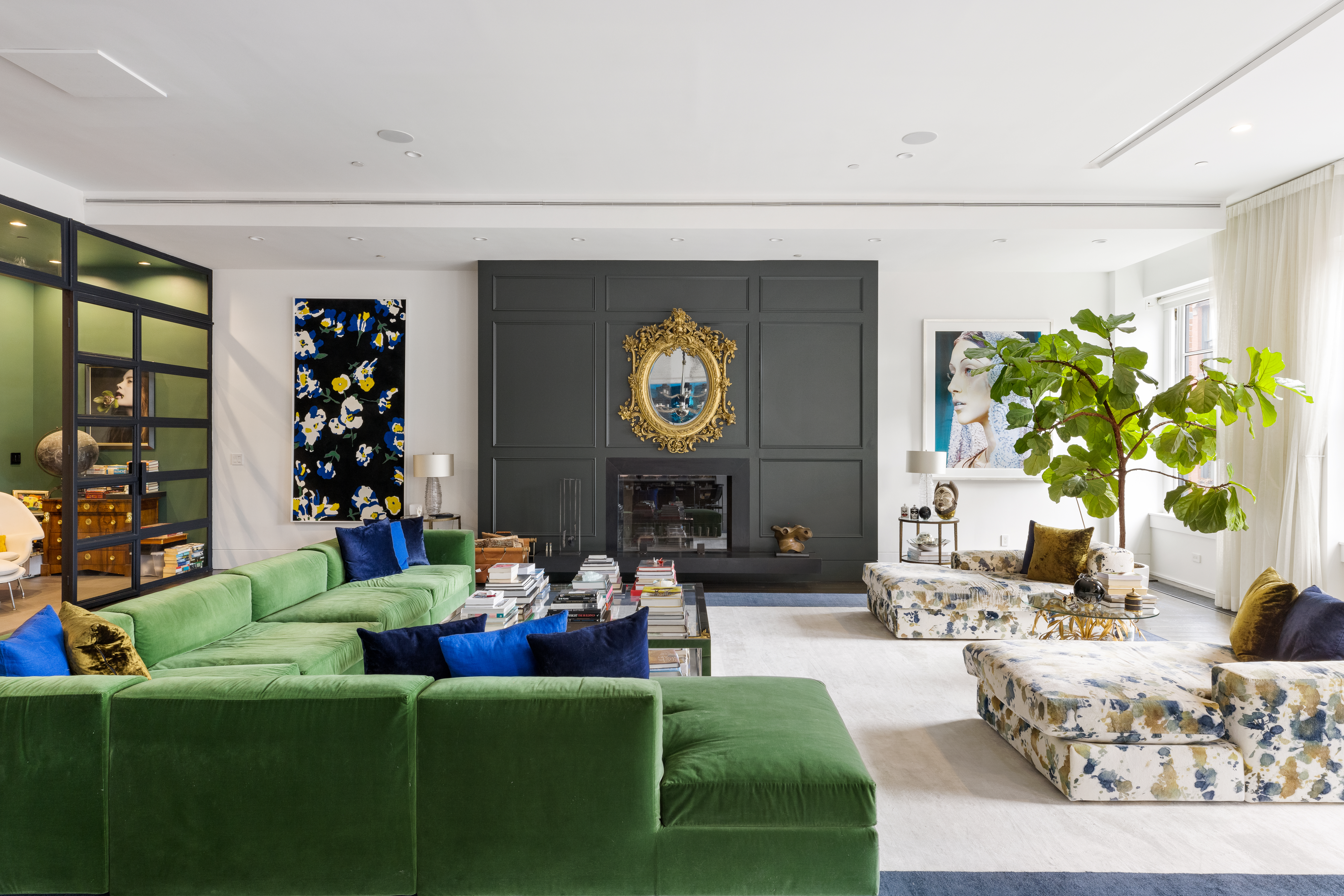 a living room with fireplace furniture and decor