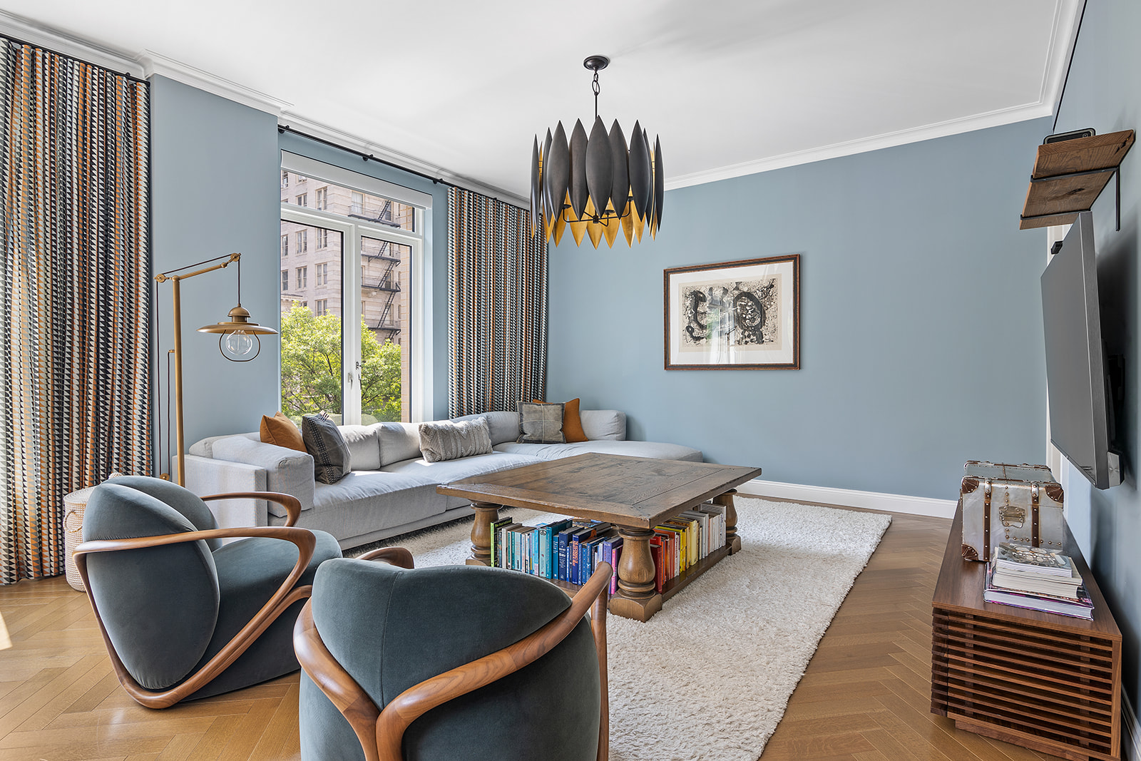 250 West 81st Street, Unit 4A Manhattan, NY 10024 - Photo 3 of 26 a living room with furniture a window and a flat screen tv