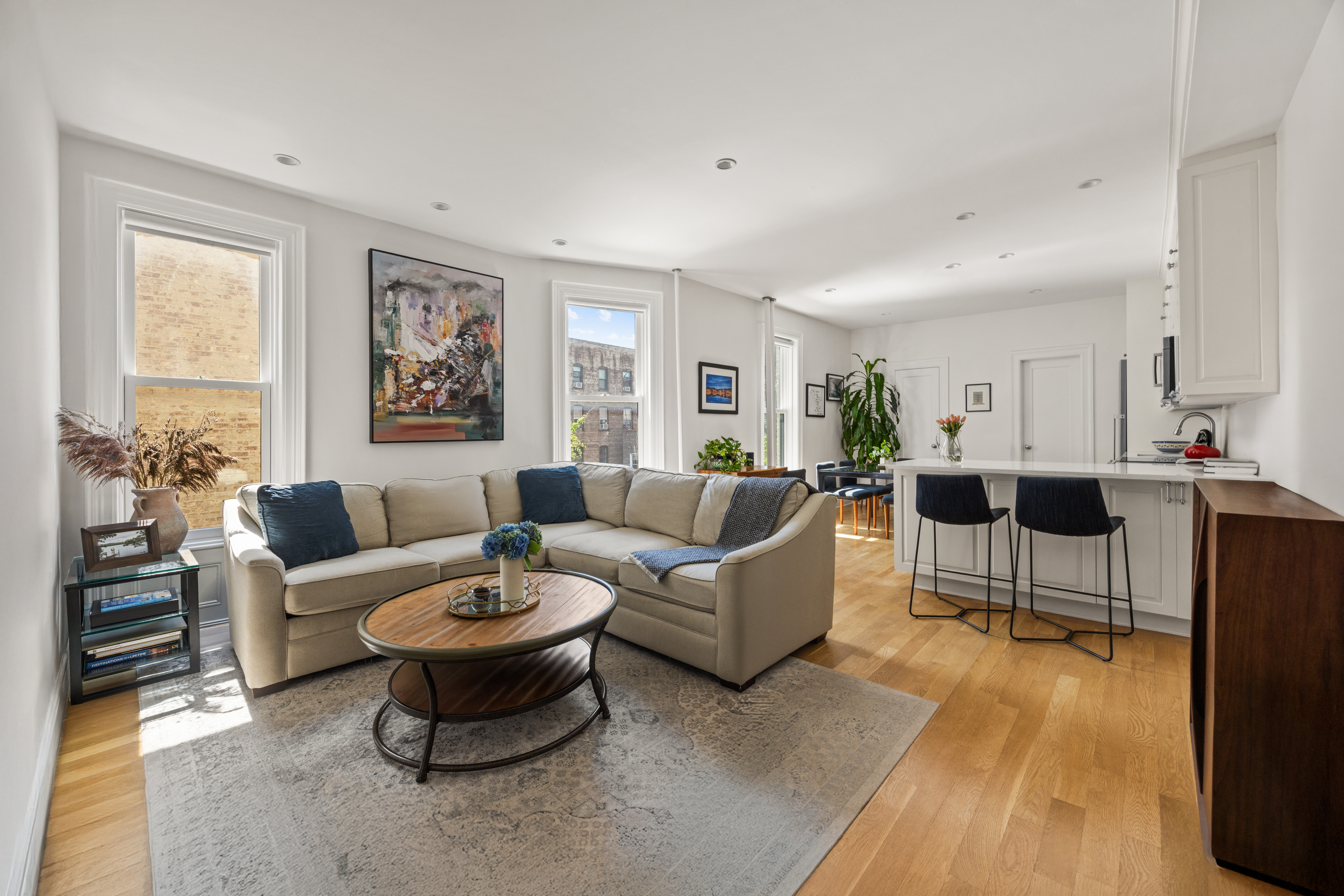 570 7th Street, Unit 3B Brooklyn, NY 11215 - Photo 2 of 9 a living room with furniture a flat screen tv and a table