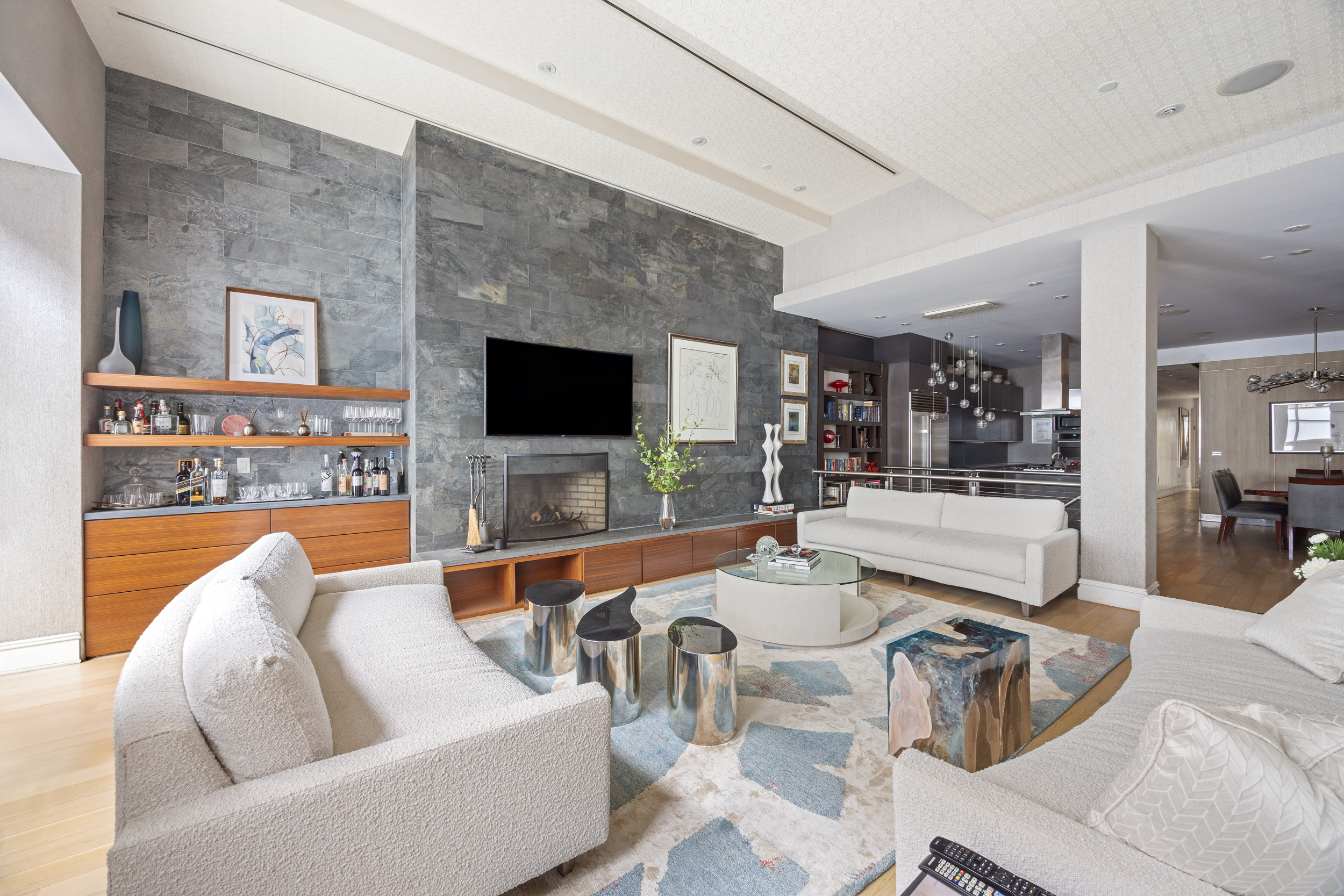 157 East 84th Street, Unit THA Manhattan, NY 10028 - Photo 4 of 33 a living room with furniture and a flat screen tv