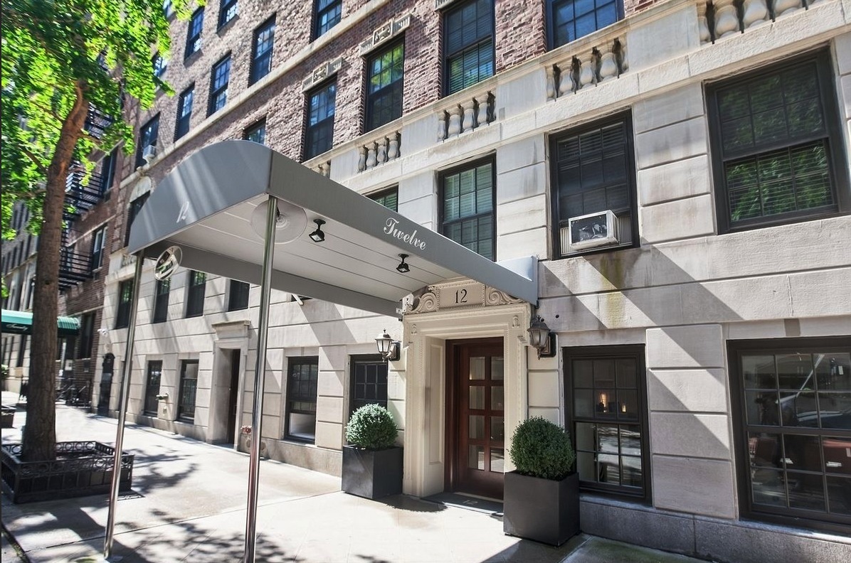 12 East 88th Street, Unit 8A Manhattan, NY 10128 - Photo 18 of 19 a view of a building with street