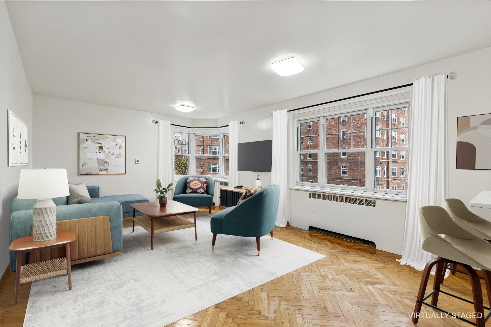 a living room with furniture a window and a table