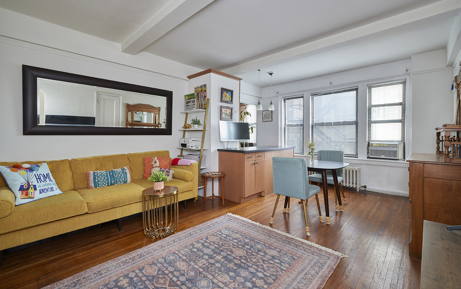 339 East 58th Street, Unit 9H Manhattan, NY 10022 - Photo 2 of 7 a living room with furniture and a wooden floor