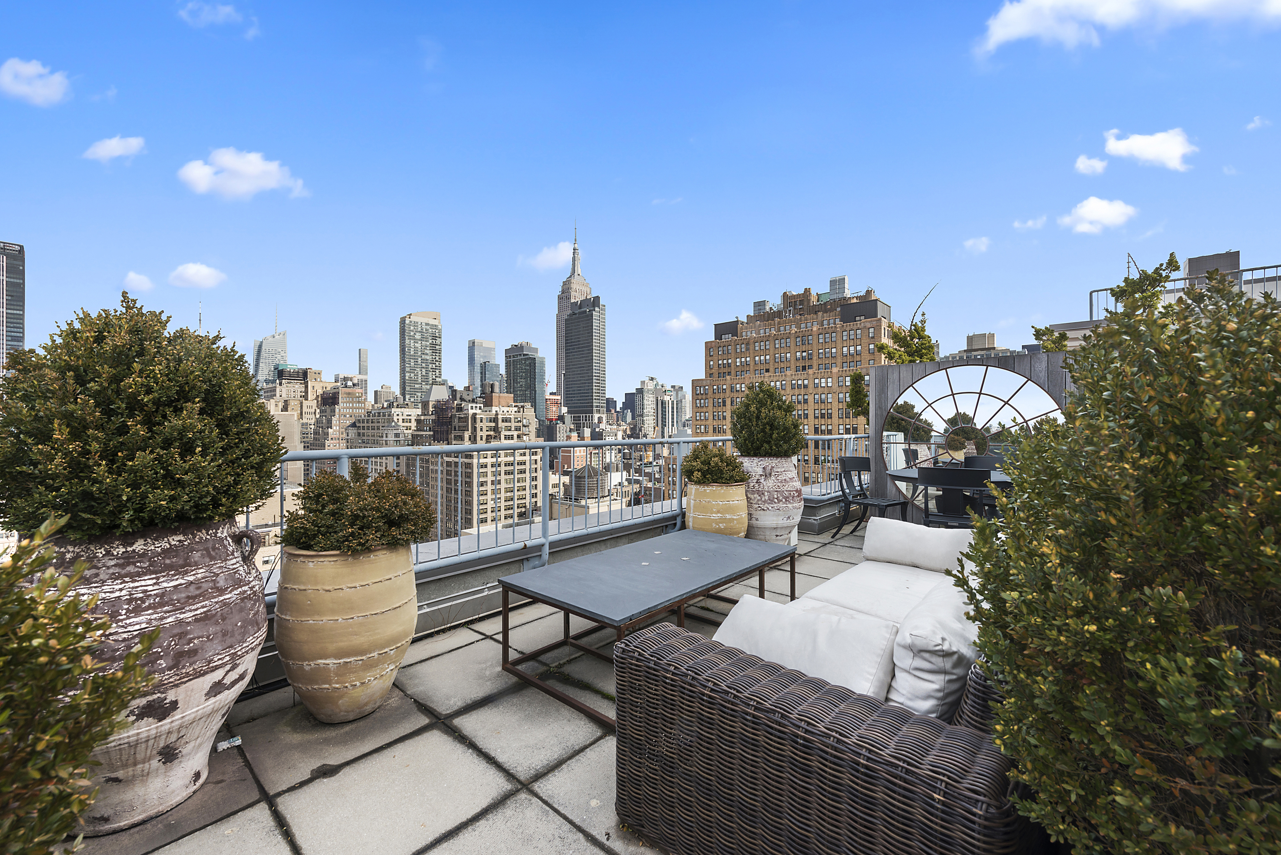 252 7th Avenue, Unit PHD Manhattan, NY 10001 - Photo 7 of 26 a view of a terrace with chairs and a potted plant