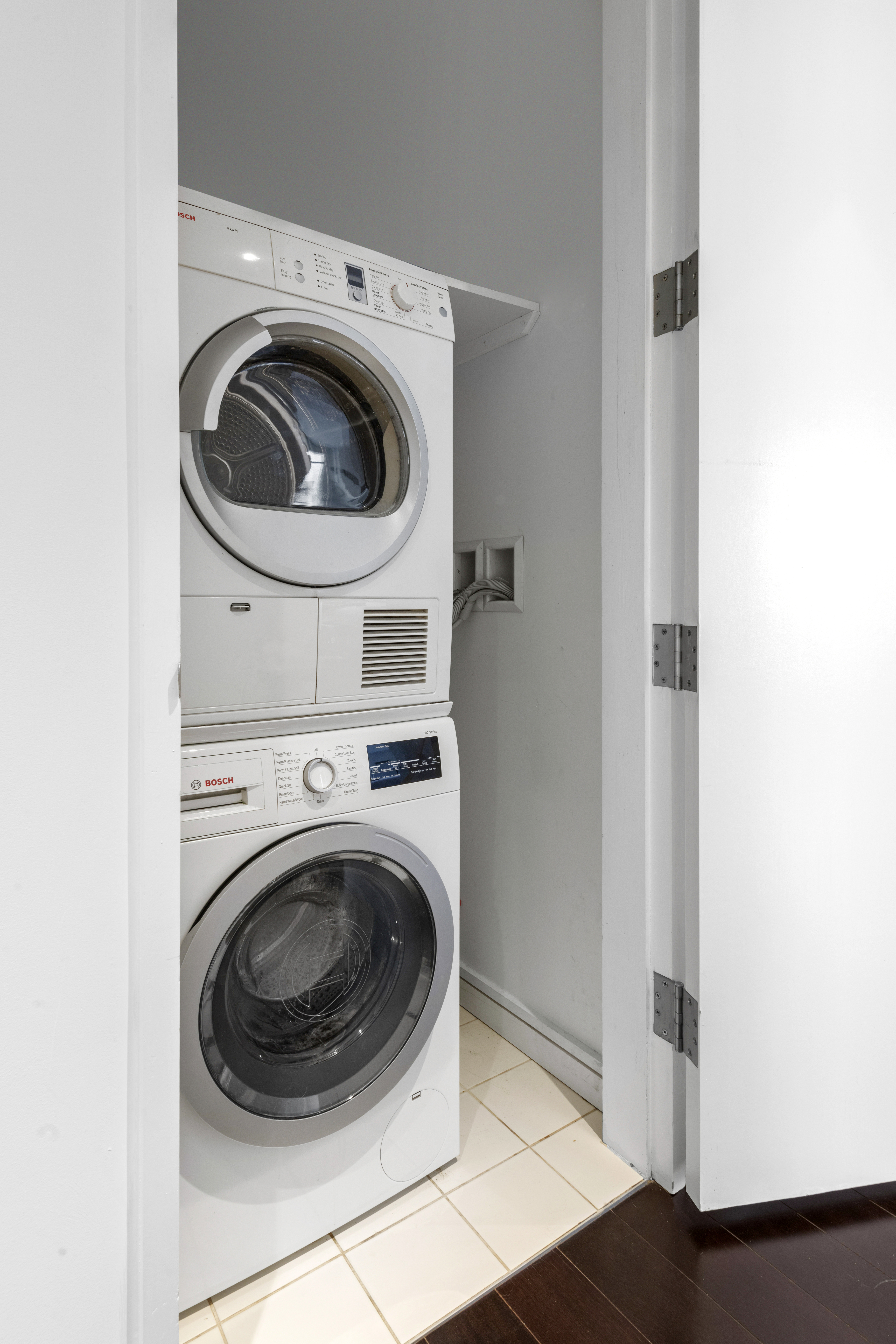 300 East 23rd Street, Unit 7A Manhattan, NY 10010 - Photo 8 of 15 a utility room with dryer and washer