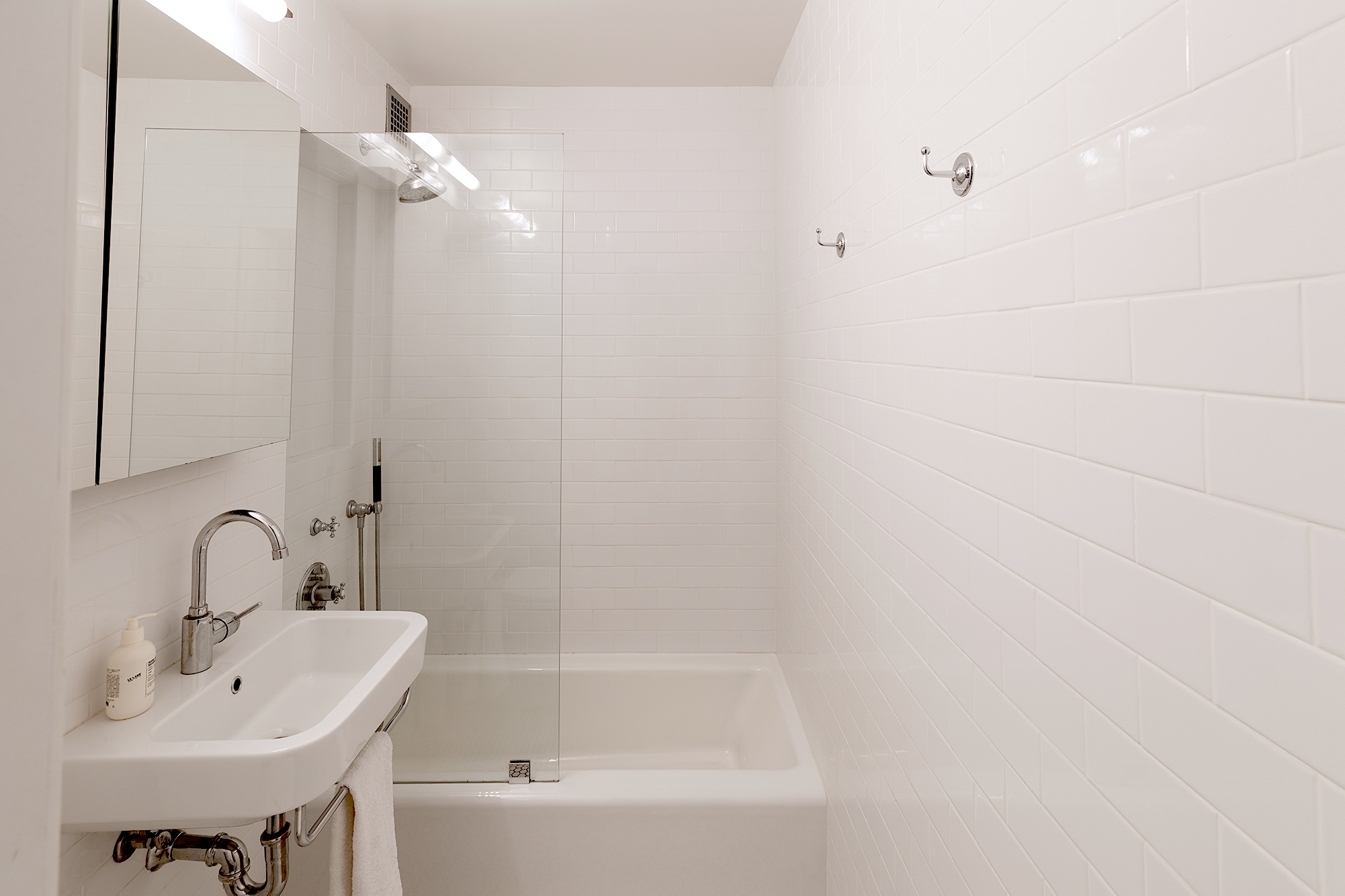 360 West 22nd Street, Unit 7P Manhattan, NY 10011 - Photo 5 of 13 a bathroom with a bathtub and a sink