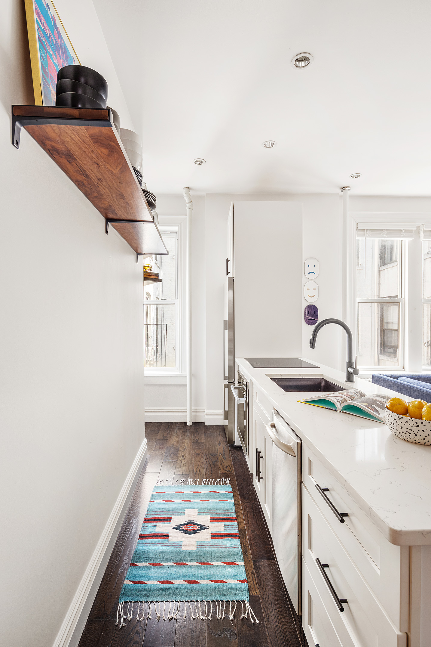124 Thompson Street, Unit 24 Manhattan, NY 10012 - Photo 3 of 10 a kitchen with a sink and a stove top oven