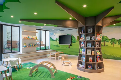 a house view with a garden space and patio