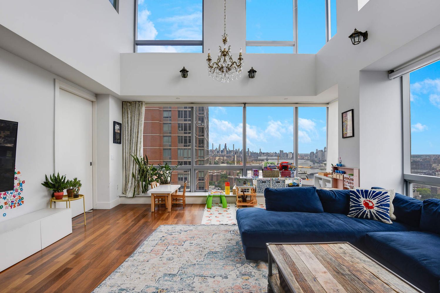 150 Myrtle Avenue, Unit PH3201 Brooklyn, NY 11201 - Photo 4 of 40 a living room with furniture and a large window