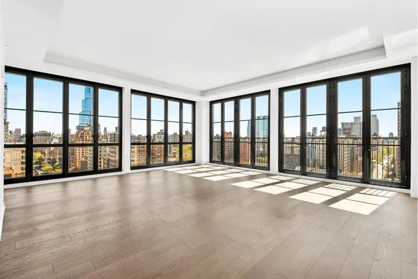 a view of an empty room with a large window