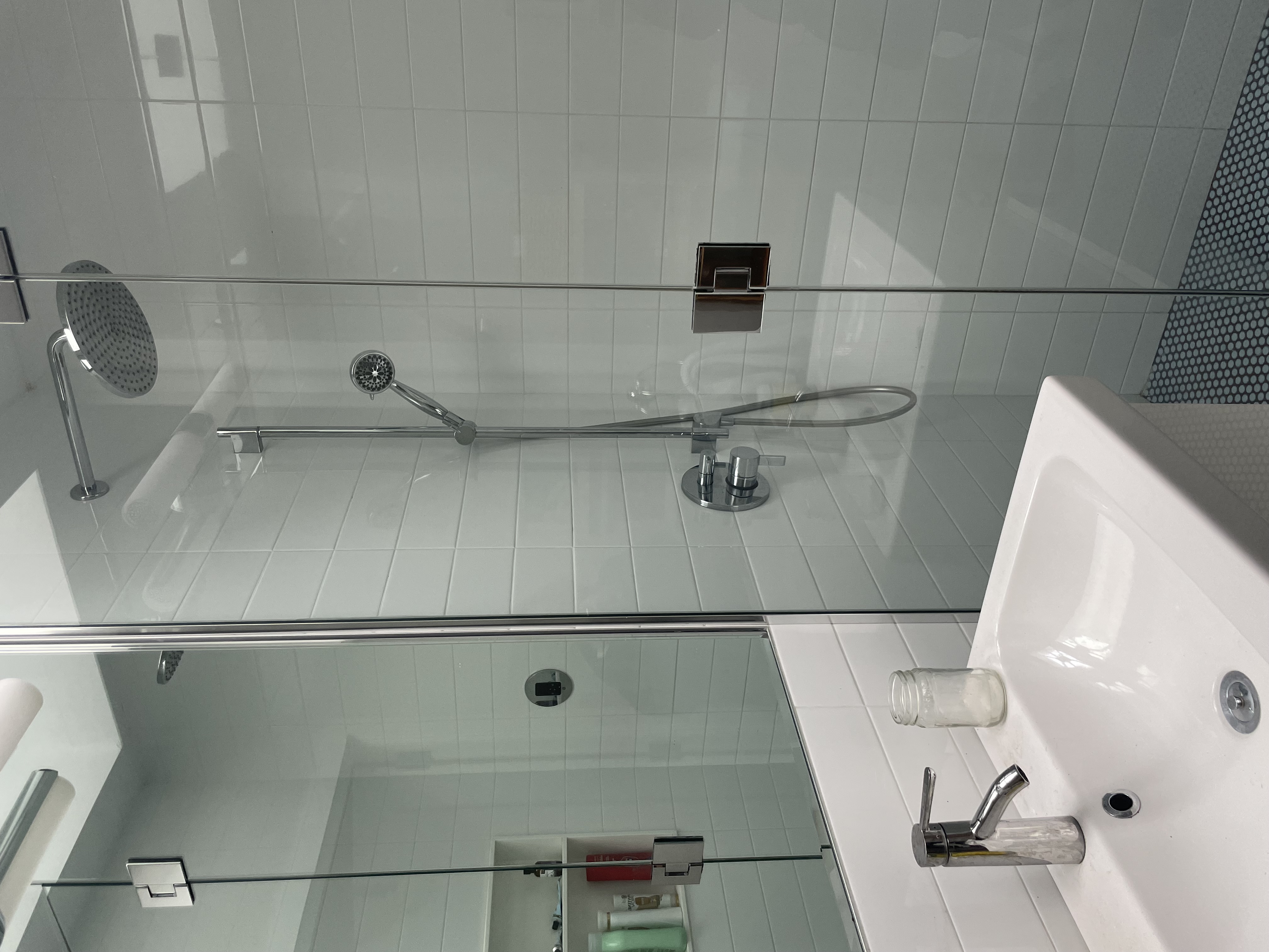 39 Clifton Place Brooklyn, NY 11238 - Photo 9 of 32 a bathroom with a sink a mirror and shower