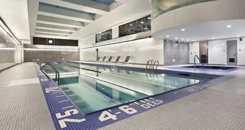 a view of a kitchen area with stainless steel appliances kitchen island stainless steel appliances and a table