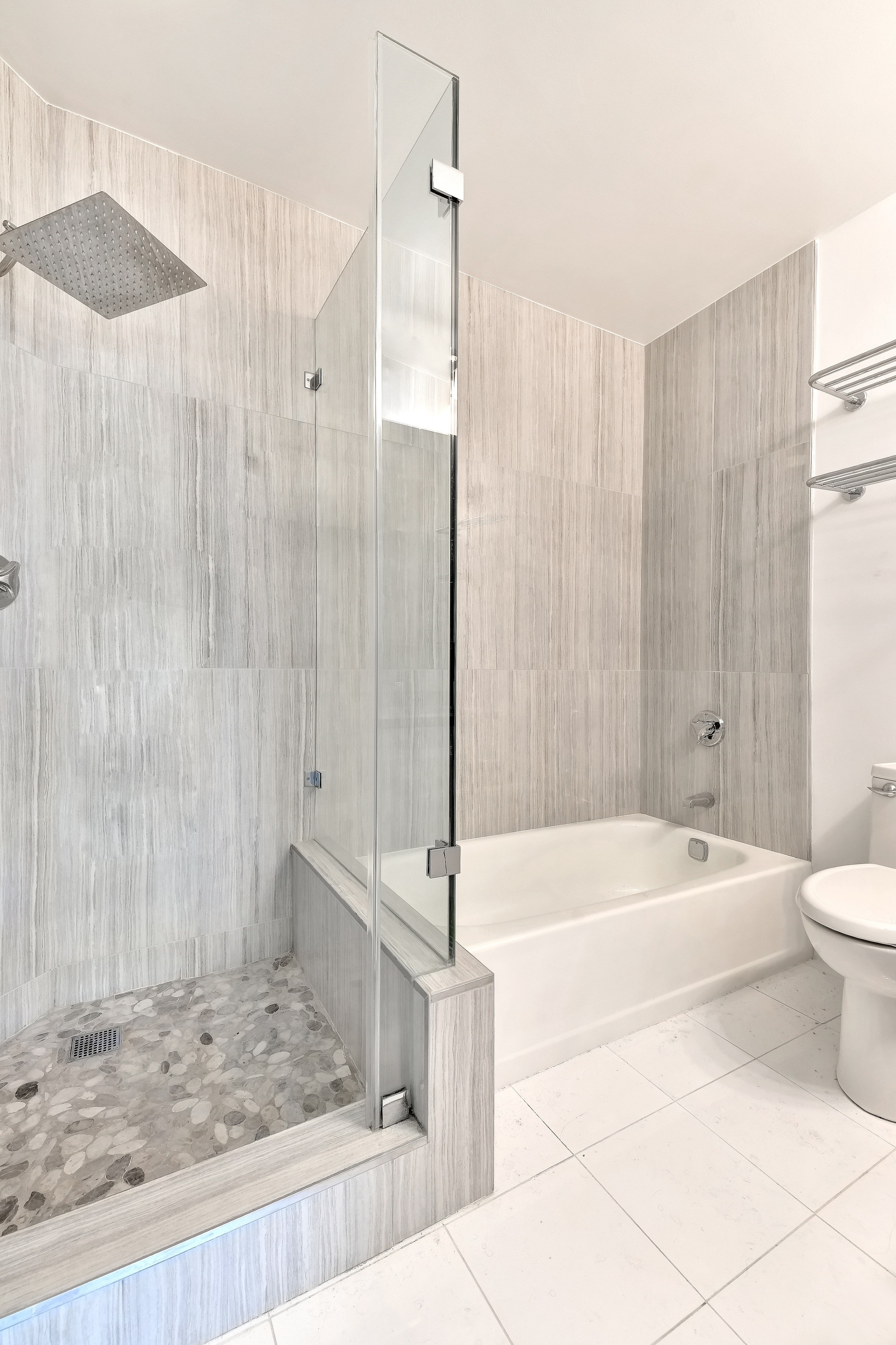 415 East 37th Street, Unit 32G Manhattan, NY 10016 - Photo 6 of 19 a bathroom with a bathtub and shower