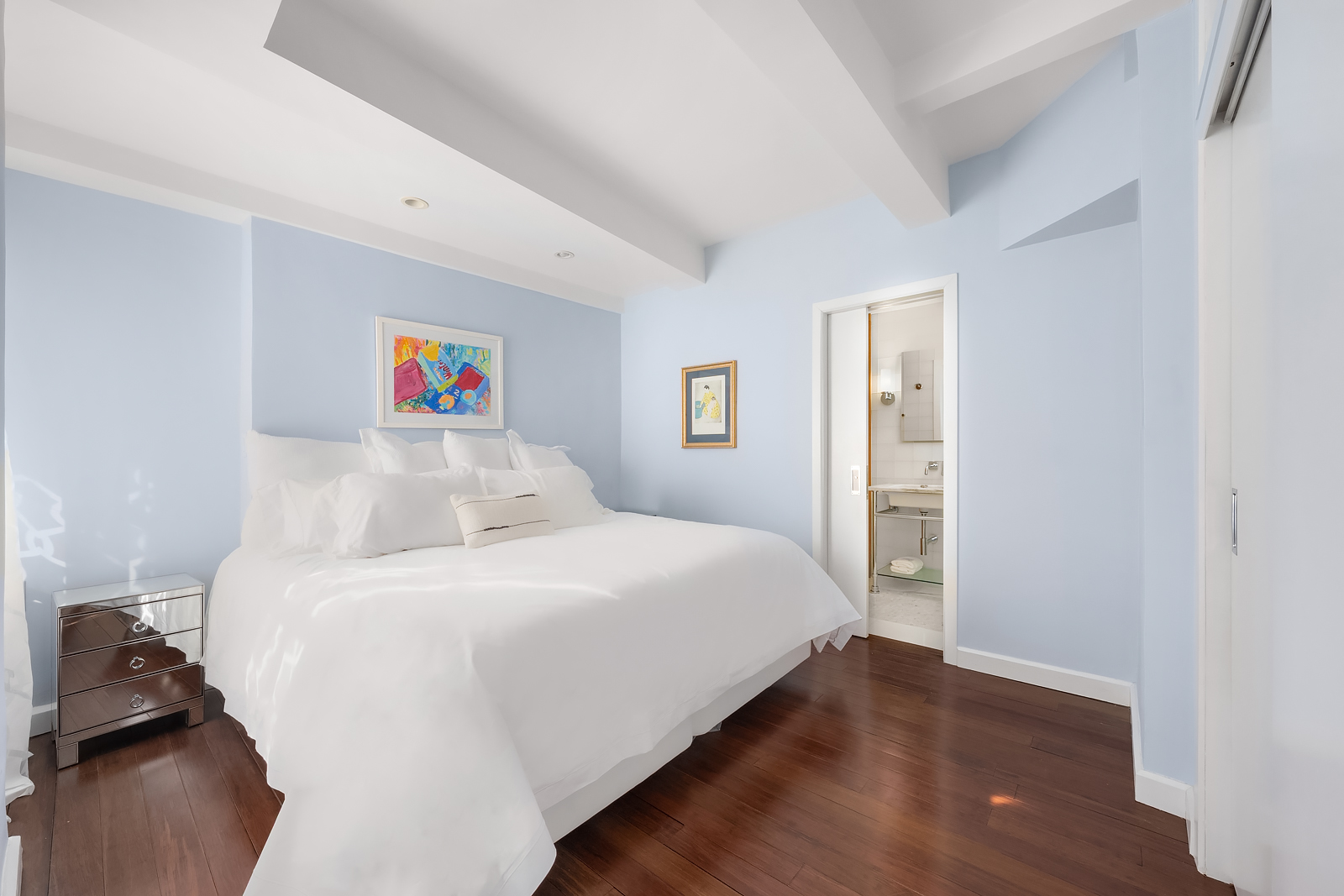 2166 Broadway, Unit 5D Manhattan, NY 10024 - Photo 6 of 11 a bedroom with a bed and wooden floor