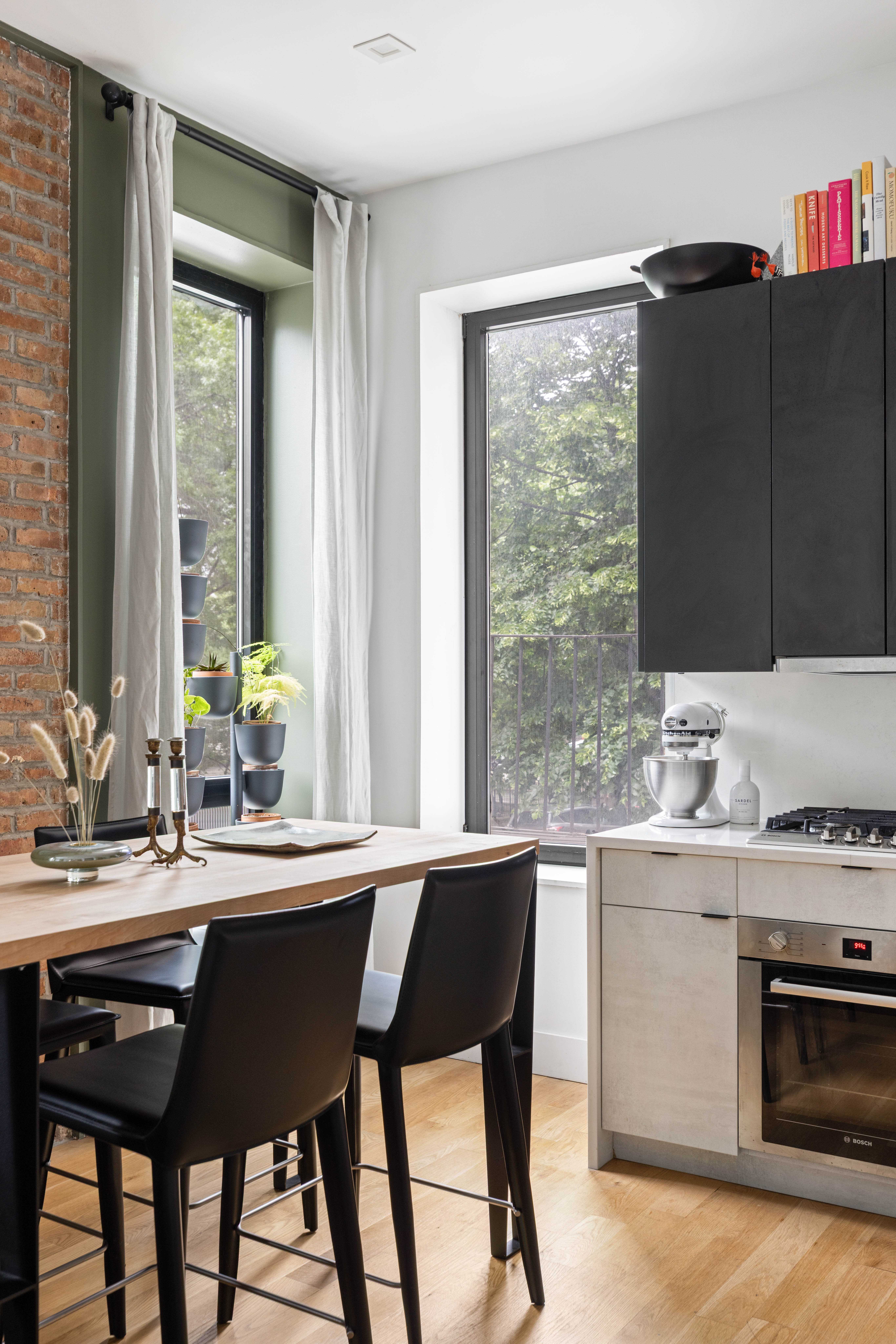 a kitchen with a sink and a stove top oven