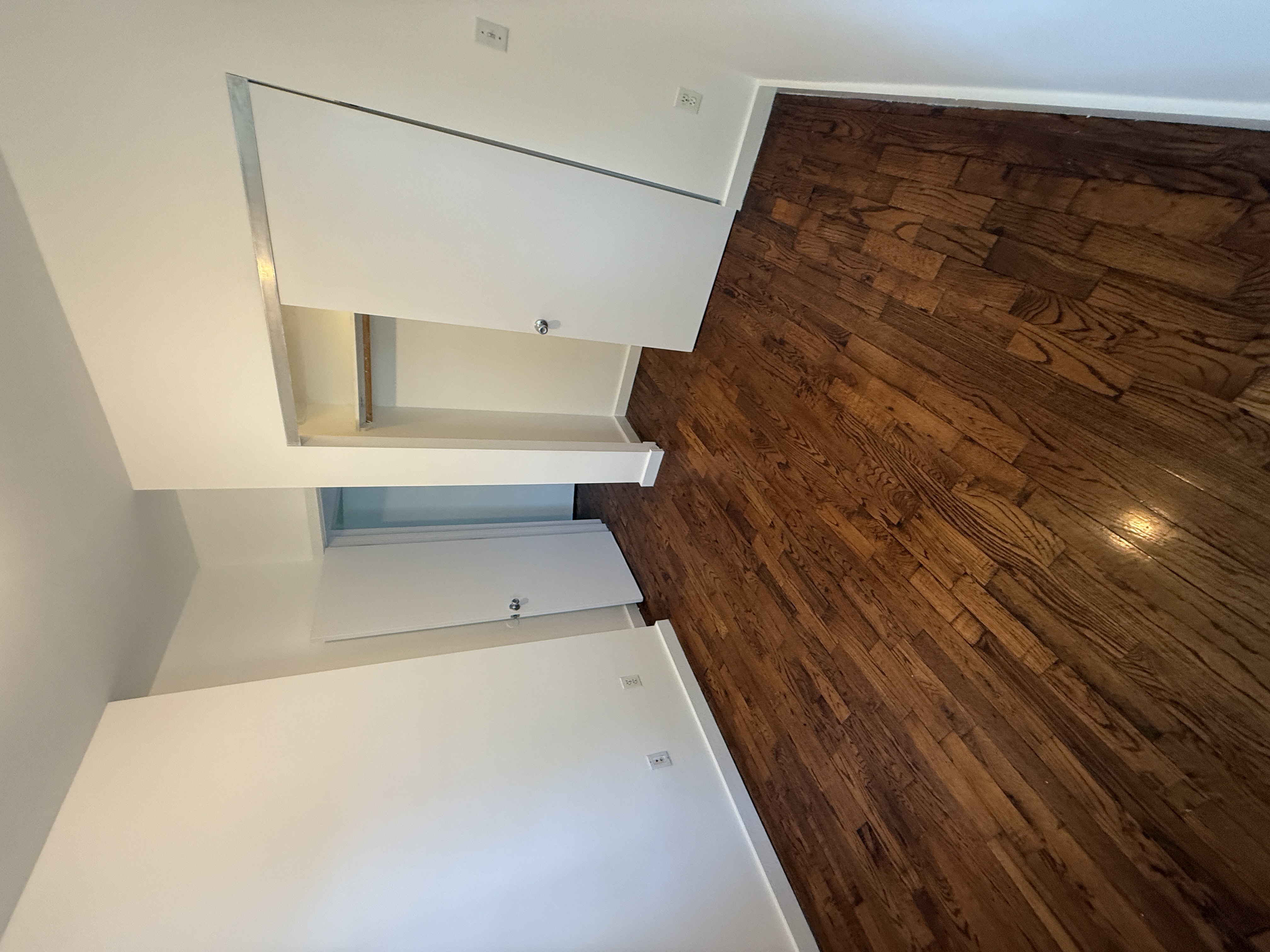 1076 Decatur Street, Unit 2 Brooklyn, NY 11207 - Photo 7 of 11 a view of empty room with wooden floor