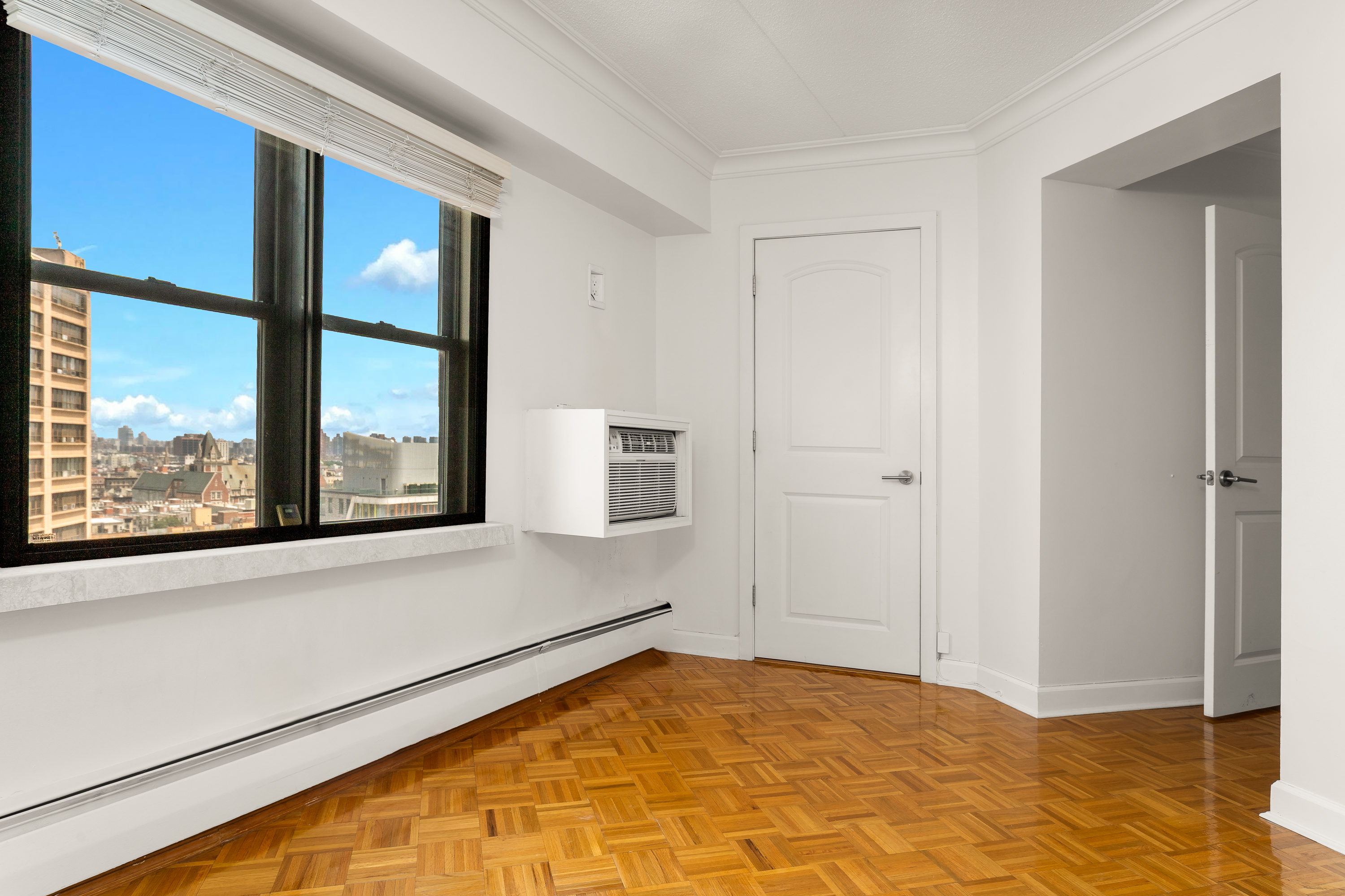 300 West 110th Street, Unit 16A Manhattan, NY 10025 - Photo 7 of 13 a view of an empty room and window