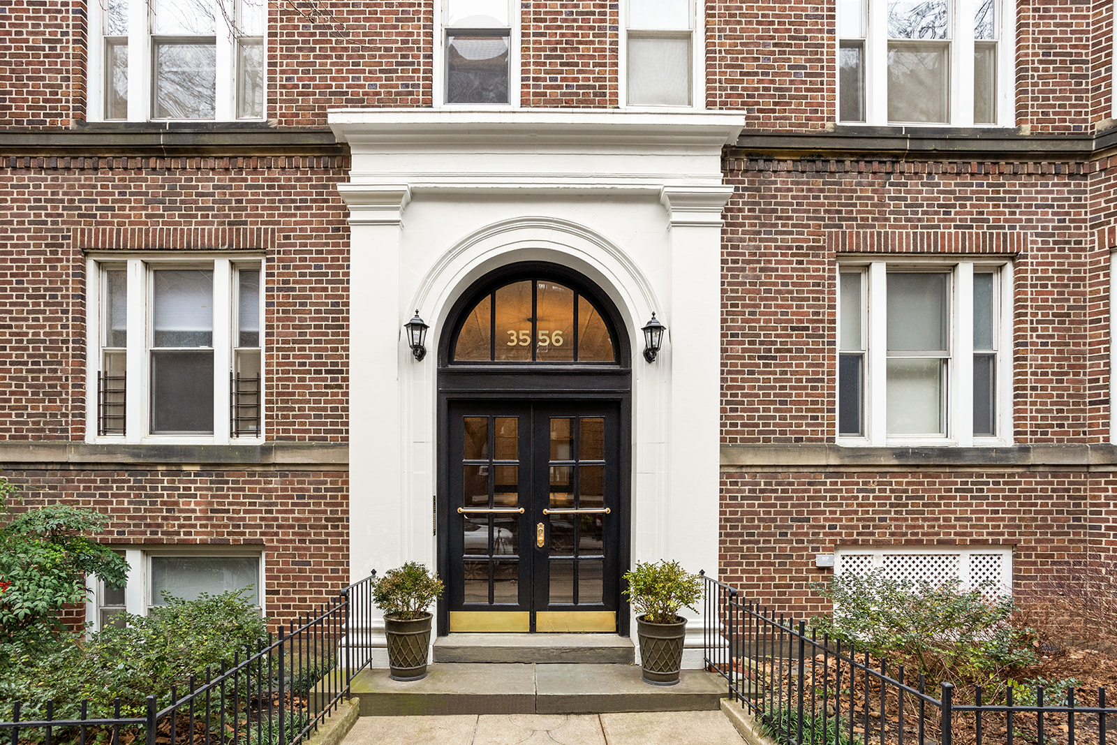35-56 79th Street, Unit 22 Queens, NY 11372 - Photo 11 of 14 a front view of a house with a garden