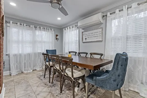 a view of a a dining table and chairs in a room