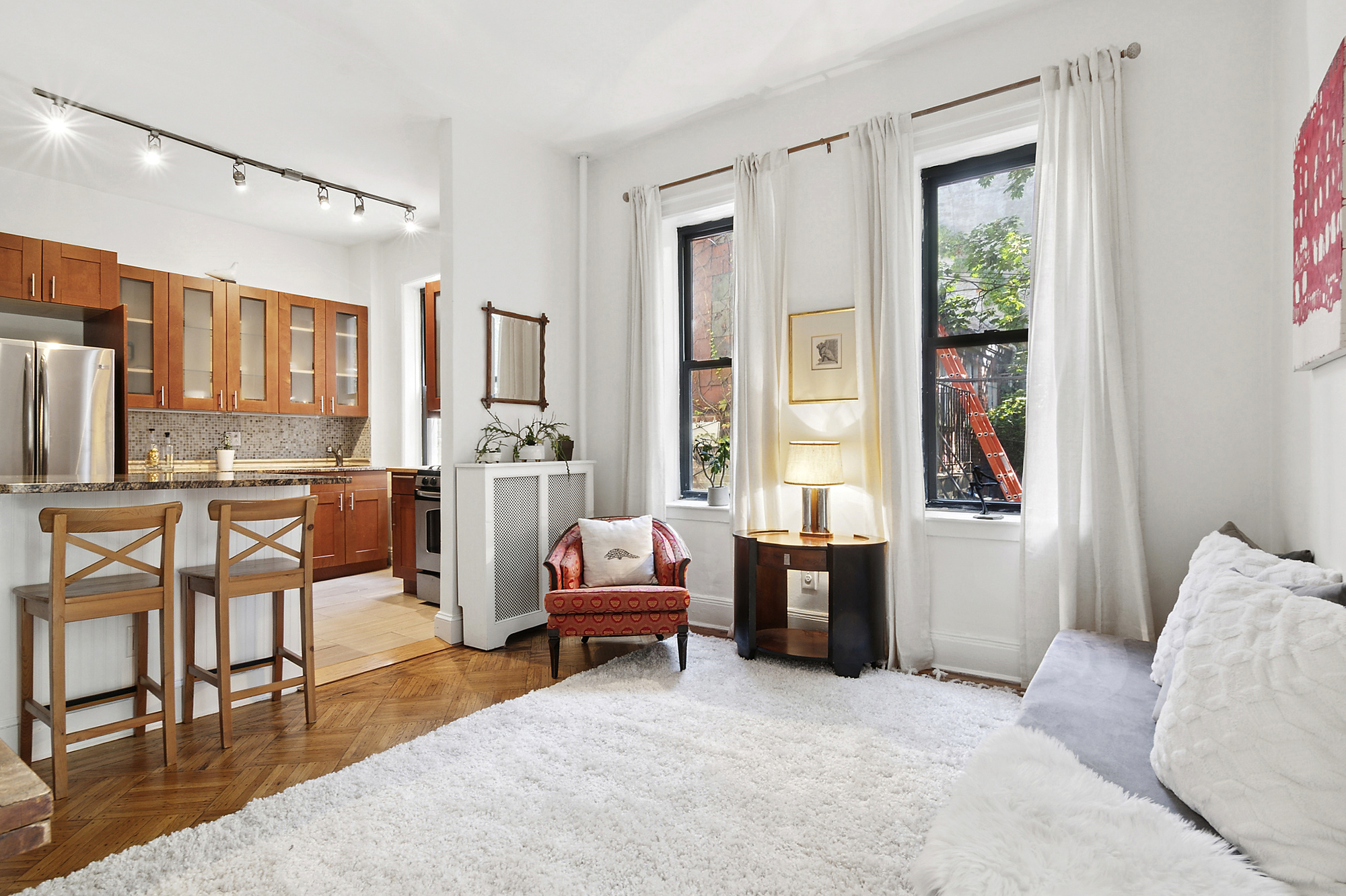368 State Street, Unit 2 Brooklyn, NY 11217 - Photo 2 of 6 a living room with furniture and a window