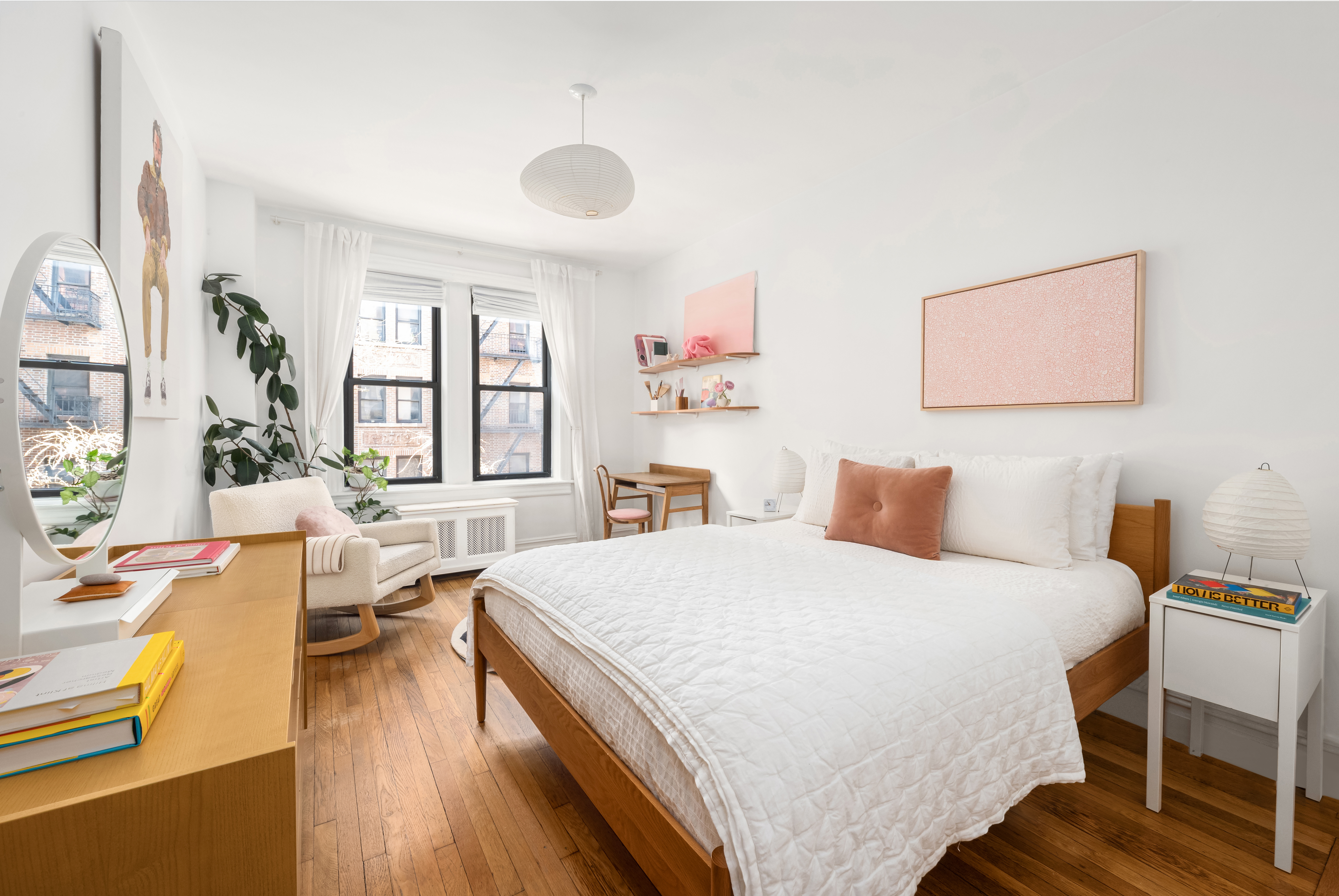 205 East 10th Street, Unit 3A Manhattan, NY 10003 - Photo 6 of 13 a bedroom with a bed and wooden floor