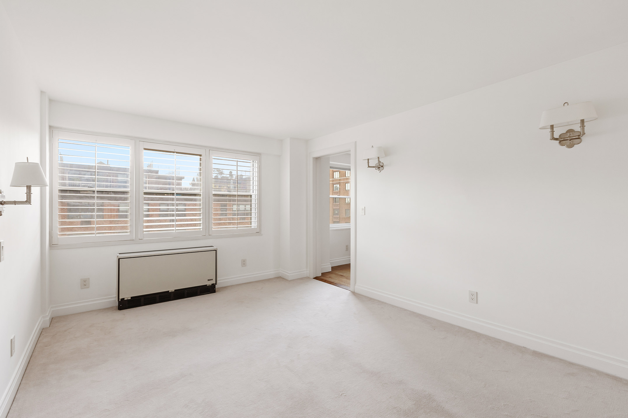 70 East 10th Street, Unit 14P Manhattan, NY 10003 - Photo 7 of 8 a view of an empty room with a window