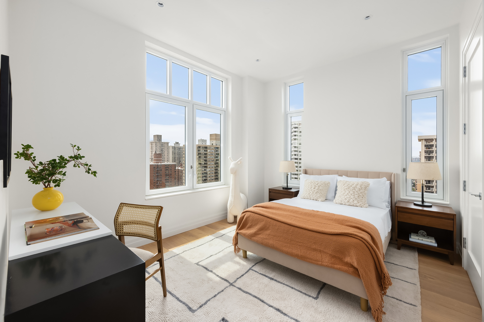 15 West 96th Street, Unit 23 Manhattan, NY 10025 - Photo 11 of 19 a bedroom with a bed table chair and a window