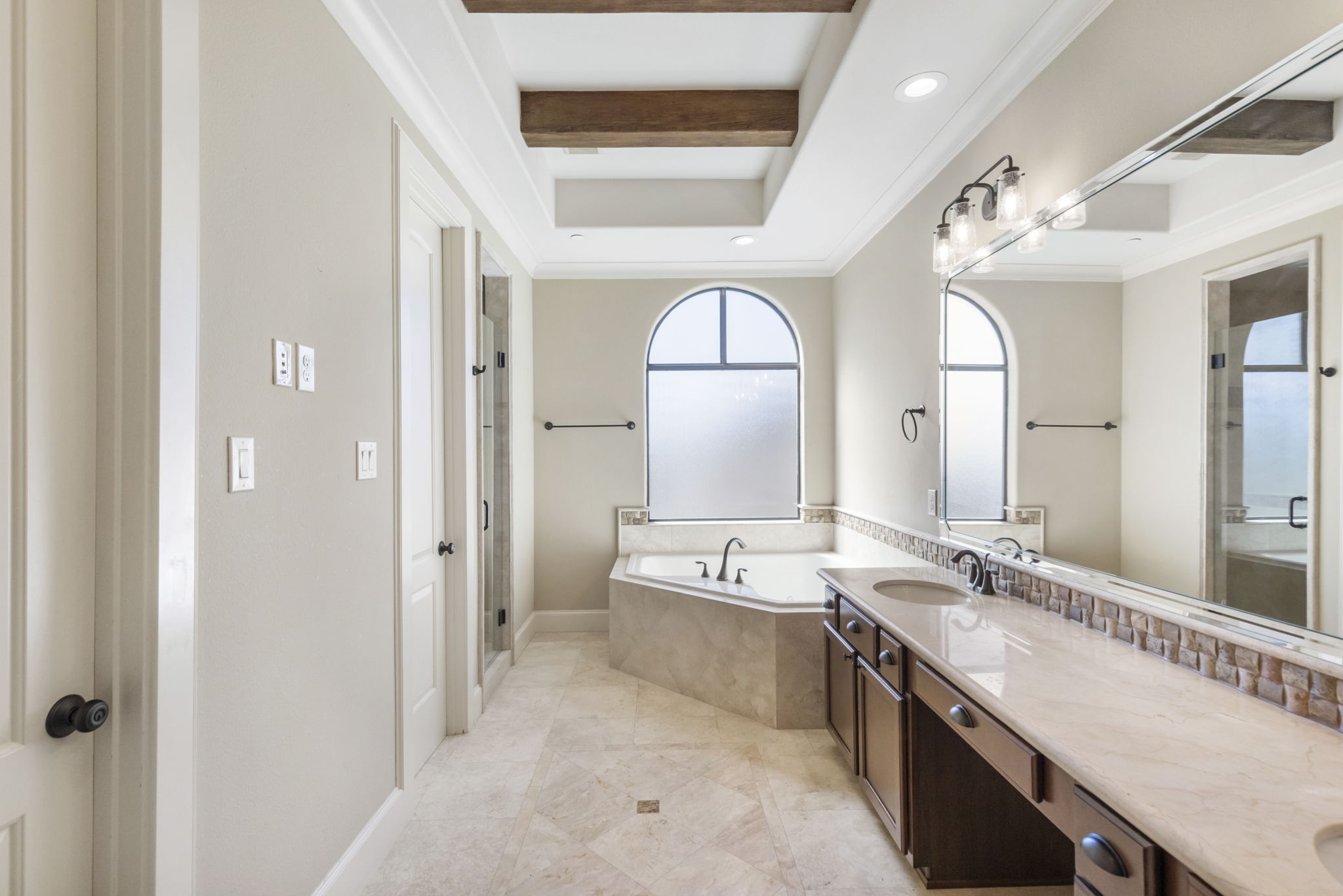 5407 Feagan Street Houston, TX 77007 - Photo 21 of 43 a large bathroom with a granite countertop tub double vanity and a mirror