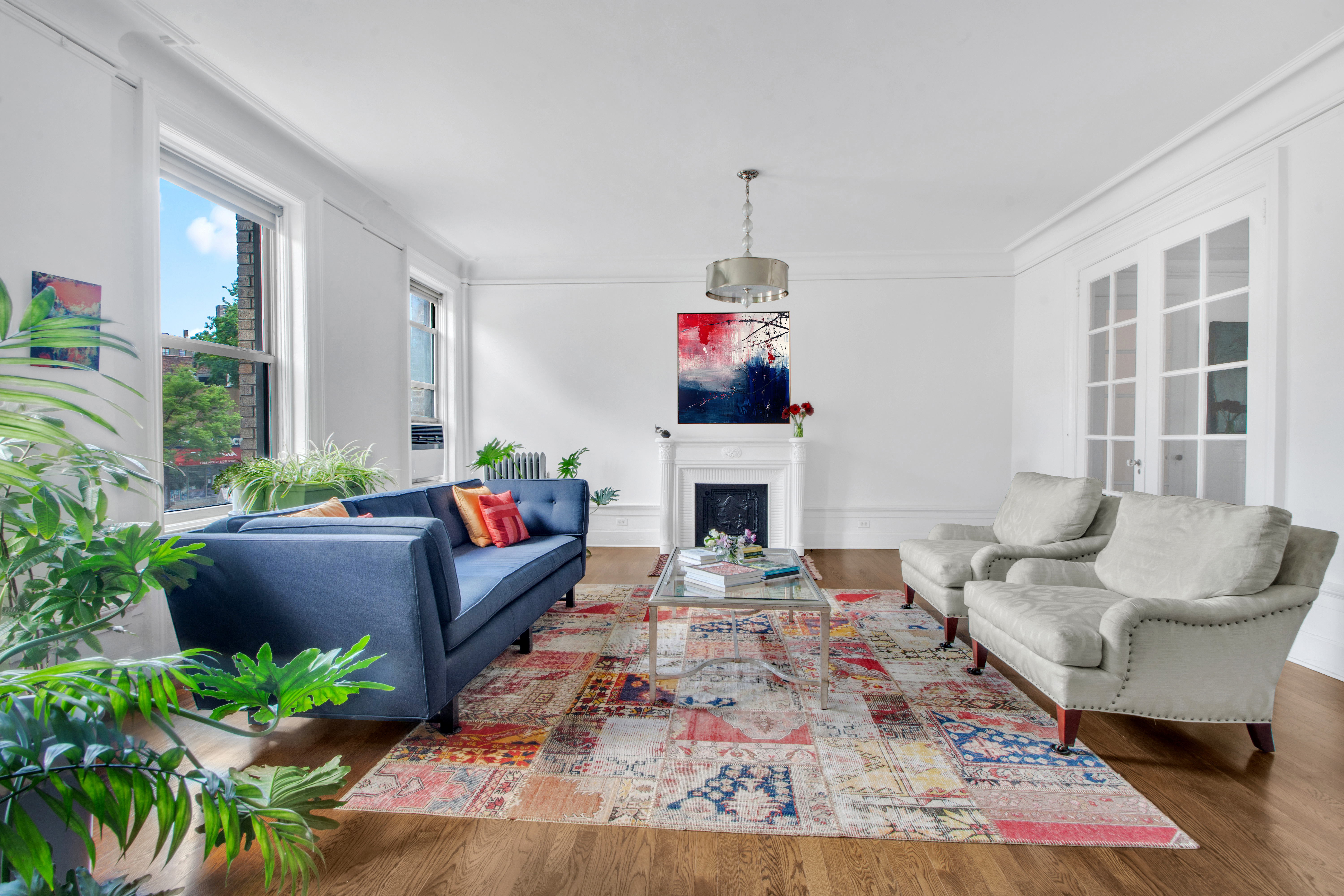 800 Riverside Drive, Unit 2E Manhattan, NY 10032 - Photo 2 of 27 a living room with furniture fireplace and a potted plant