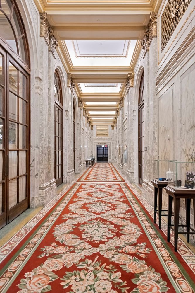 1 Central Park South, Unit 909915 Manhattan, NY 10019 - Photo 26 of 40 a view of a hallway with wooden floor and staircase