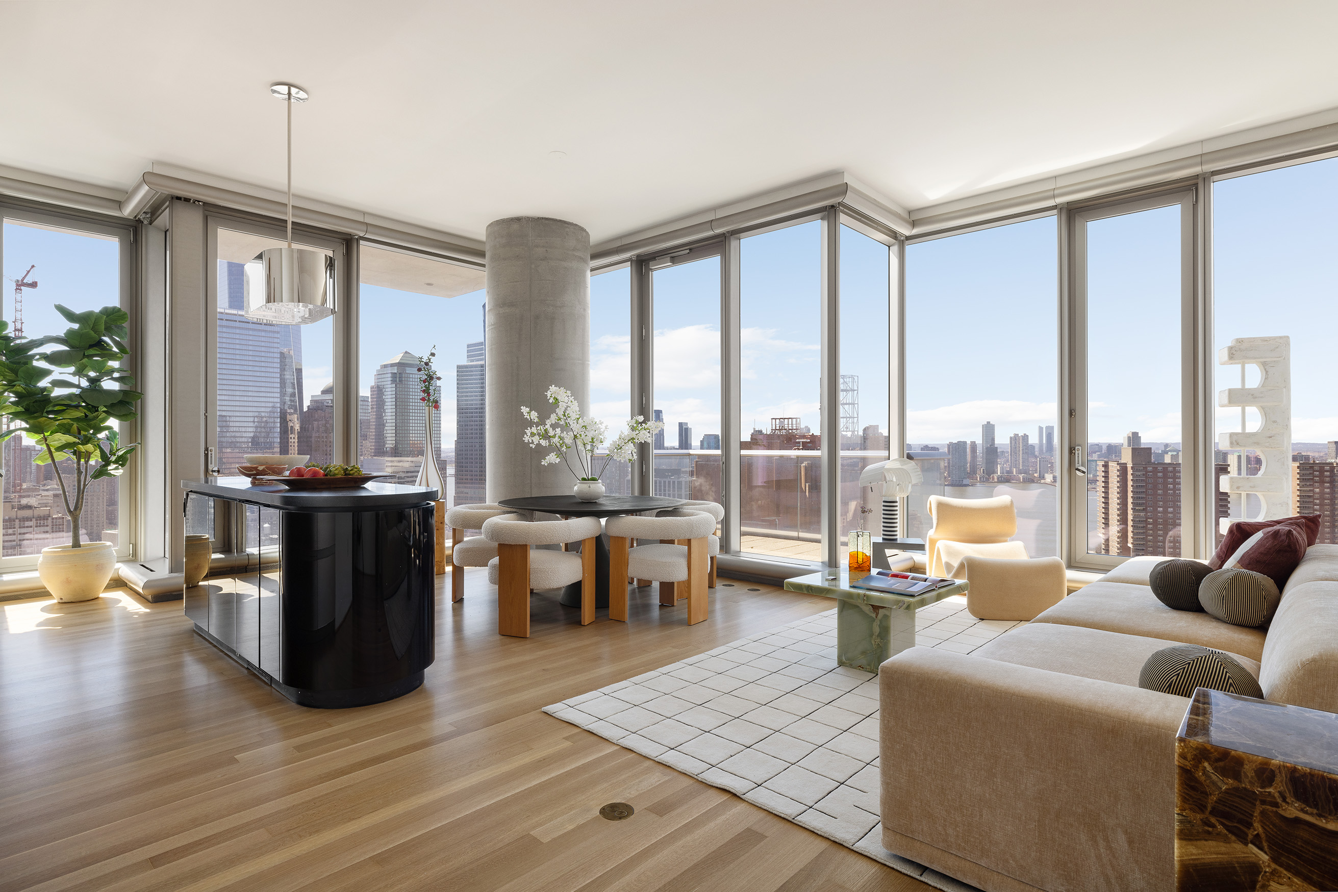 56 Leonard Street, Unit 33AWEST Manhattan, NY 10013 - Photo 1 of 12 a living room with furniture large windows and wooden floor